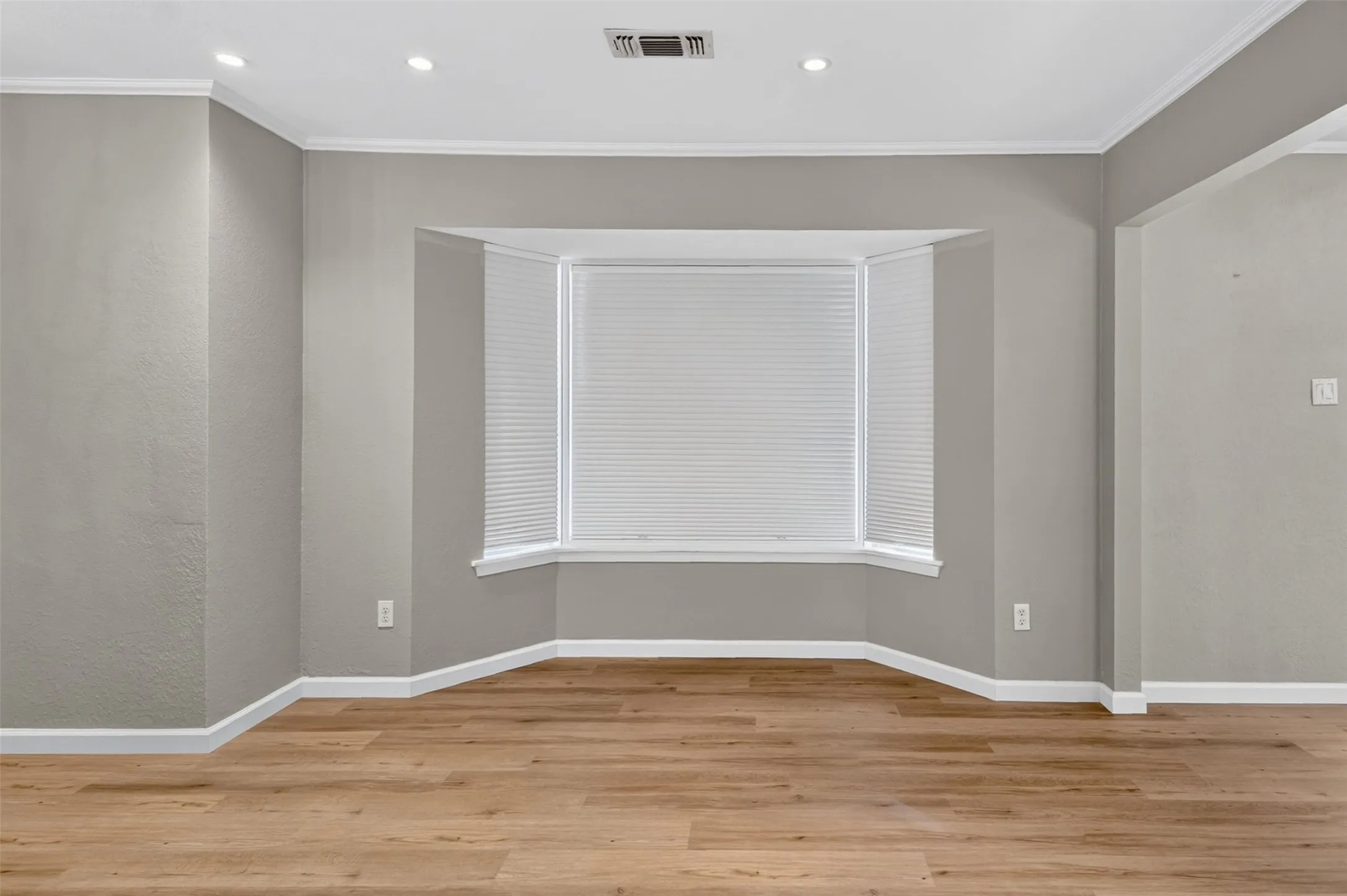Crown molding and Bay windows add a special touch