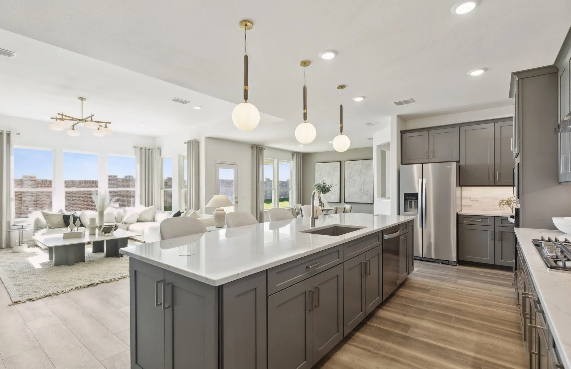 *Model Representation - Large island overlooking gathering room and dining areas