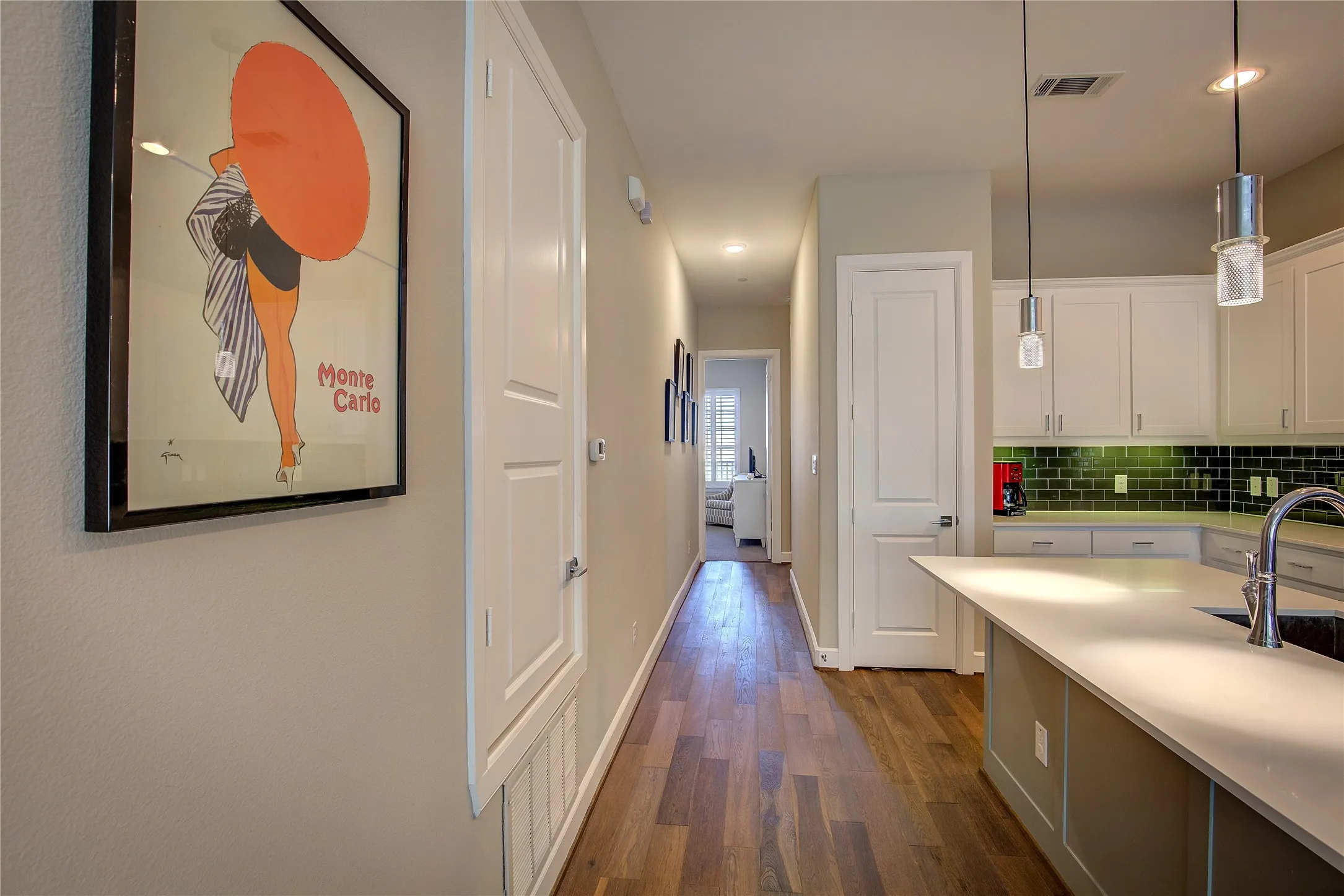 Looking from Living Room, past Kitchen, to Primary and Entry..