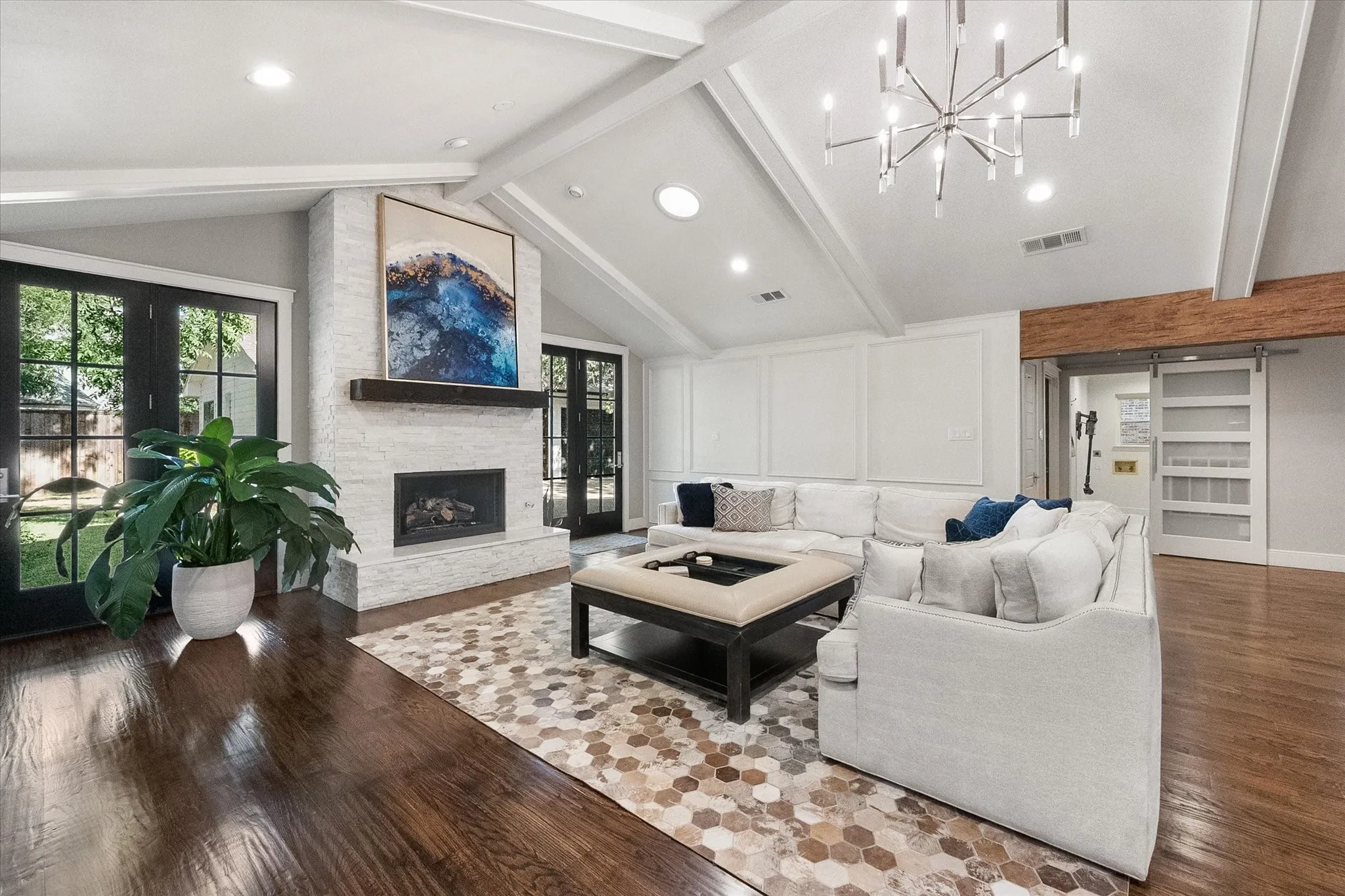 Open concept family room with vaulted ceiling and loads of natural light