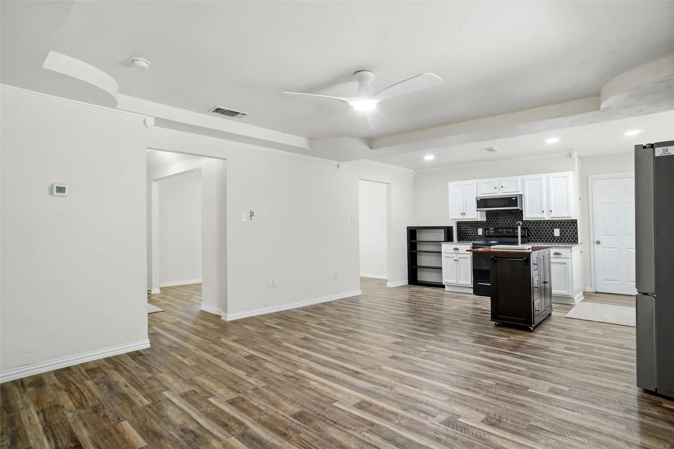 Open concept between living and kitchen