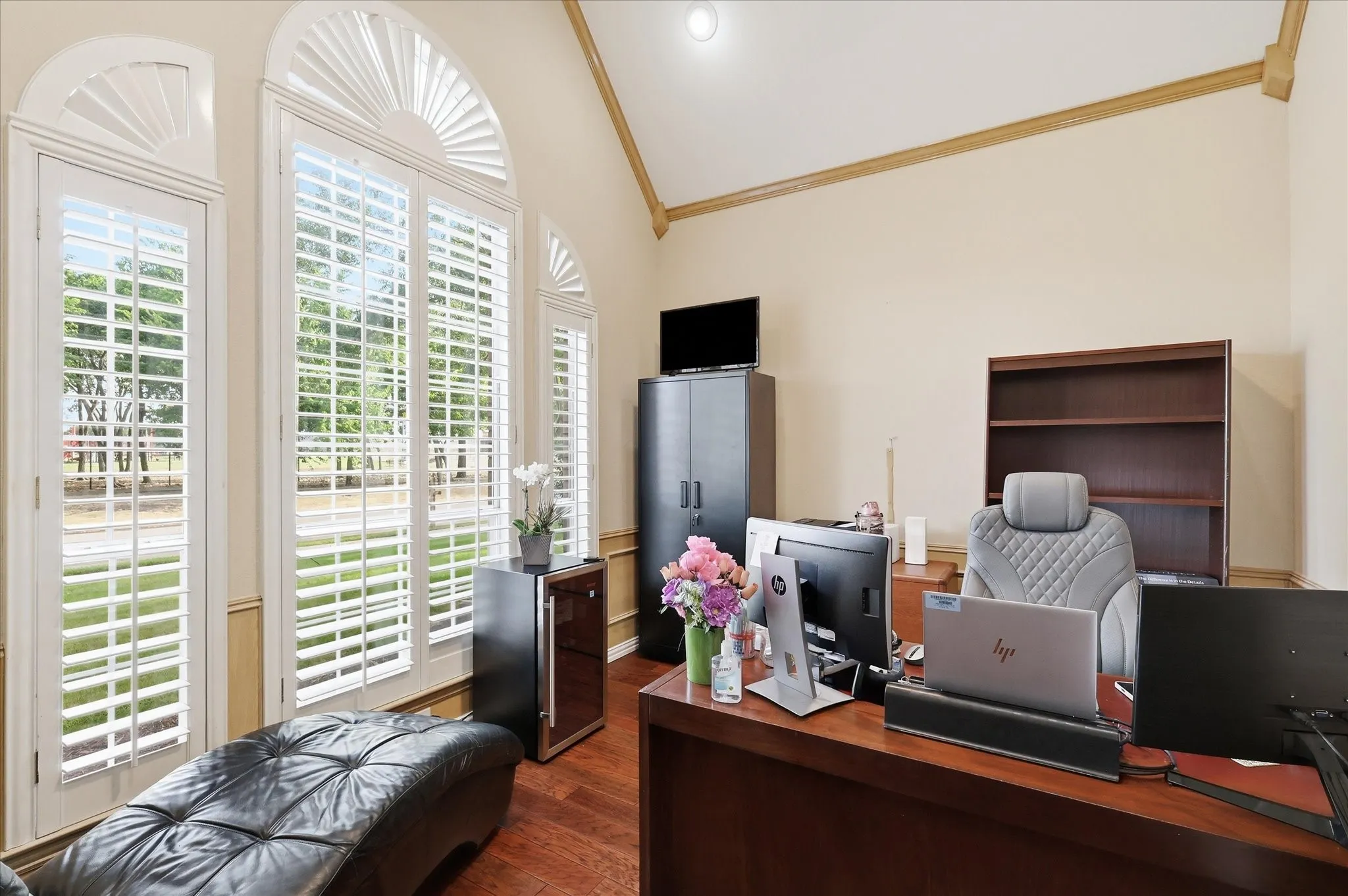 Private office area with french doors, high ceilings, plantation shutters and new ceiling fan