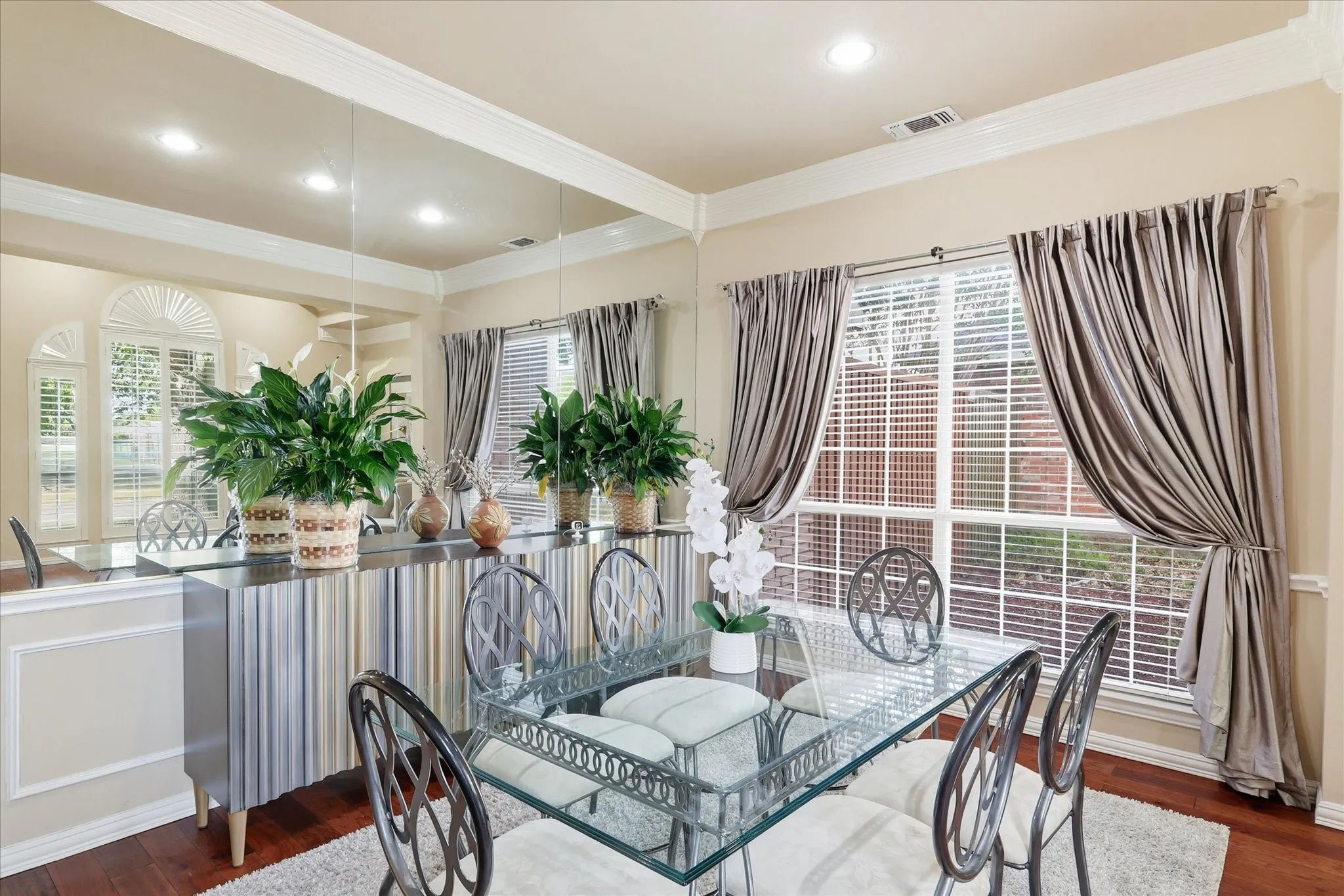 Dining room featuring wood floors and wood trim.