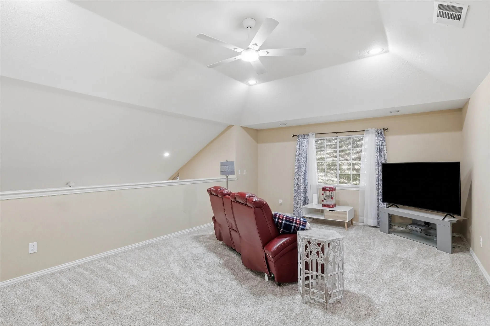 Upstairs game room that overlooks the downstairs family room. Great space for kids play area.