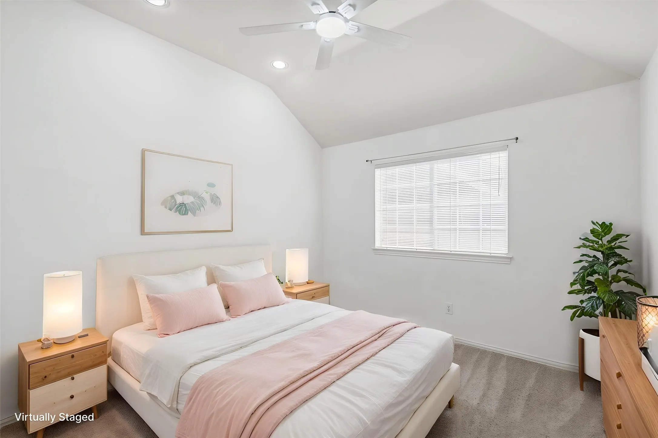 Bedroom 2 upstairs that is virtually staged. Featuring vaulted ceiling and new ceiling fan
