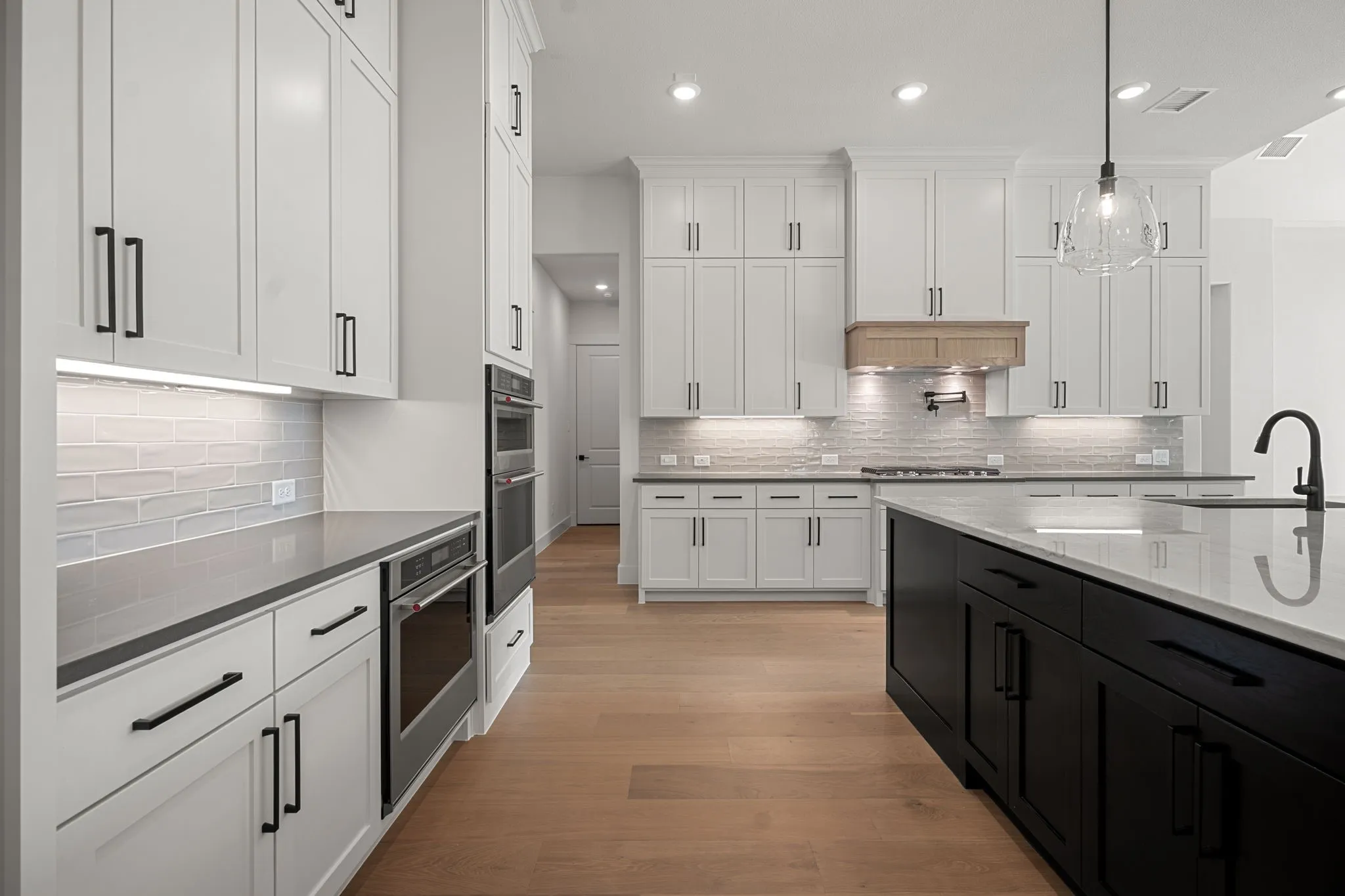 Beautiful double stacked cabinetry, gorgeous countertops and classic backsplash effortlessly combine with modern stainless steel to create a kitchen for the ages!