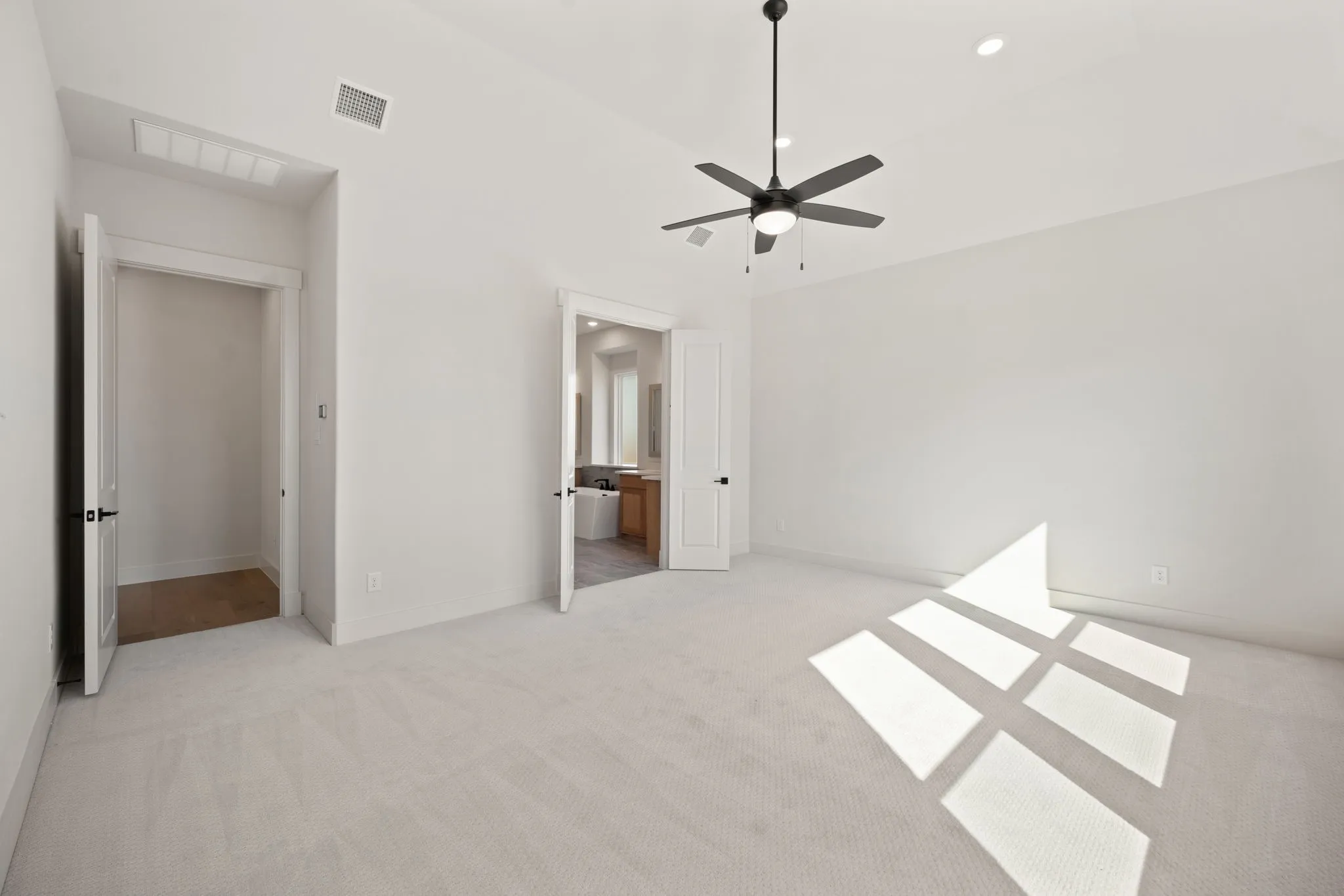The peaceful owner's suite is located at the rear of the home for additional privacey.