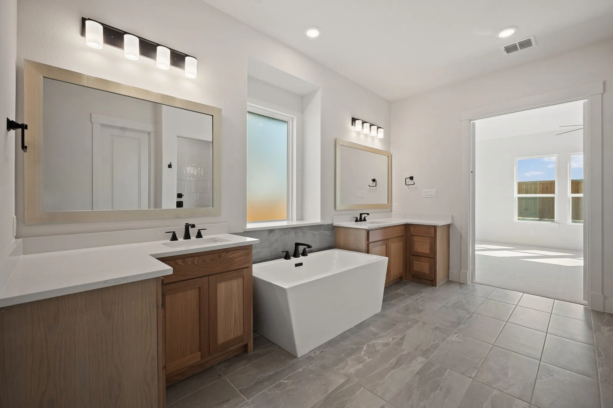 With ample room for two, a freestanding tub and step in shower, you'll enjoy a spa like experience every day in this wonderful owner's bath.