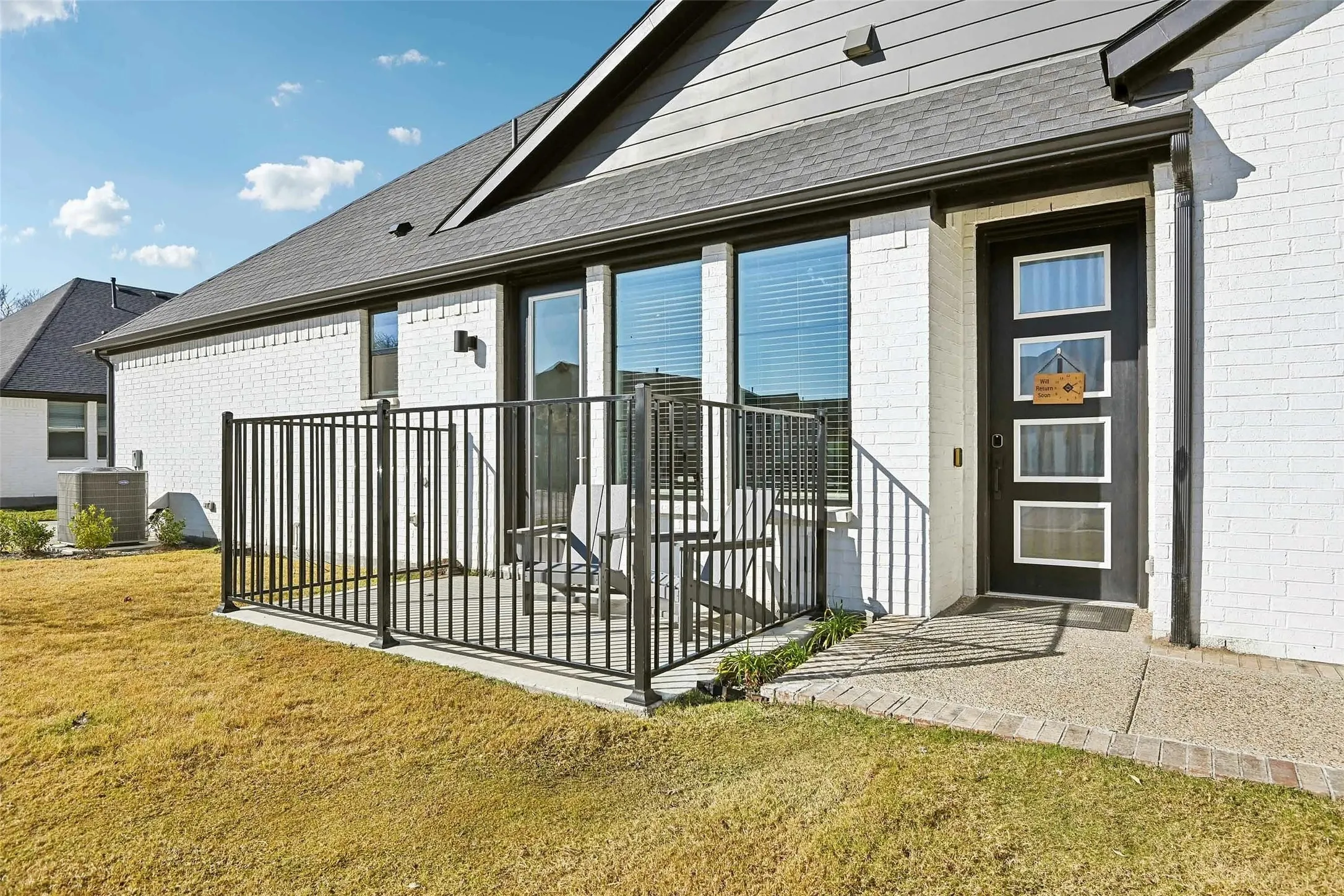 Private patio with black metal fencing