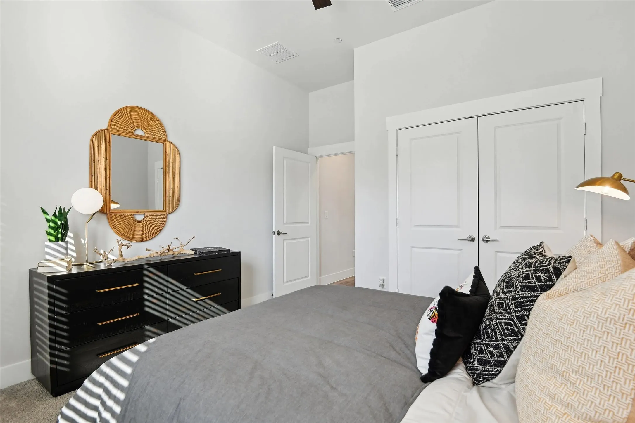 Recessed ceiling lighting, white interior doors, and neutral wall paint