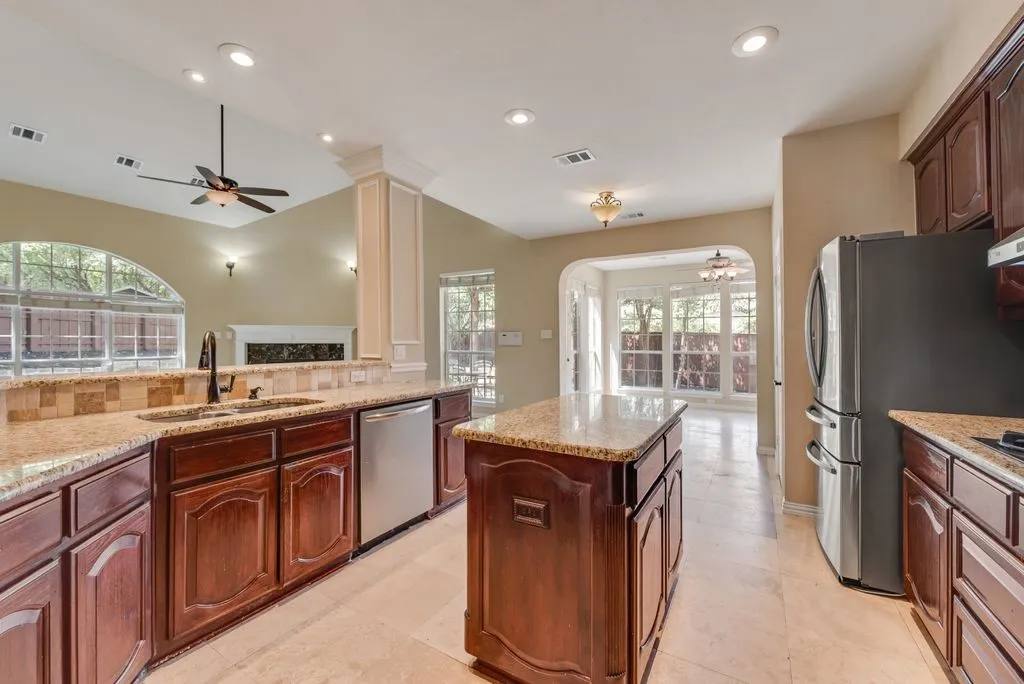 Large Kitchen, leads to sun room, dining area, and open to the family room.