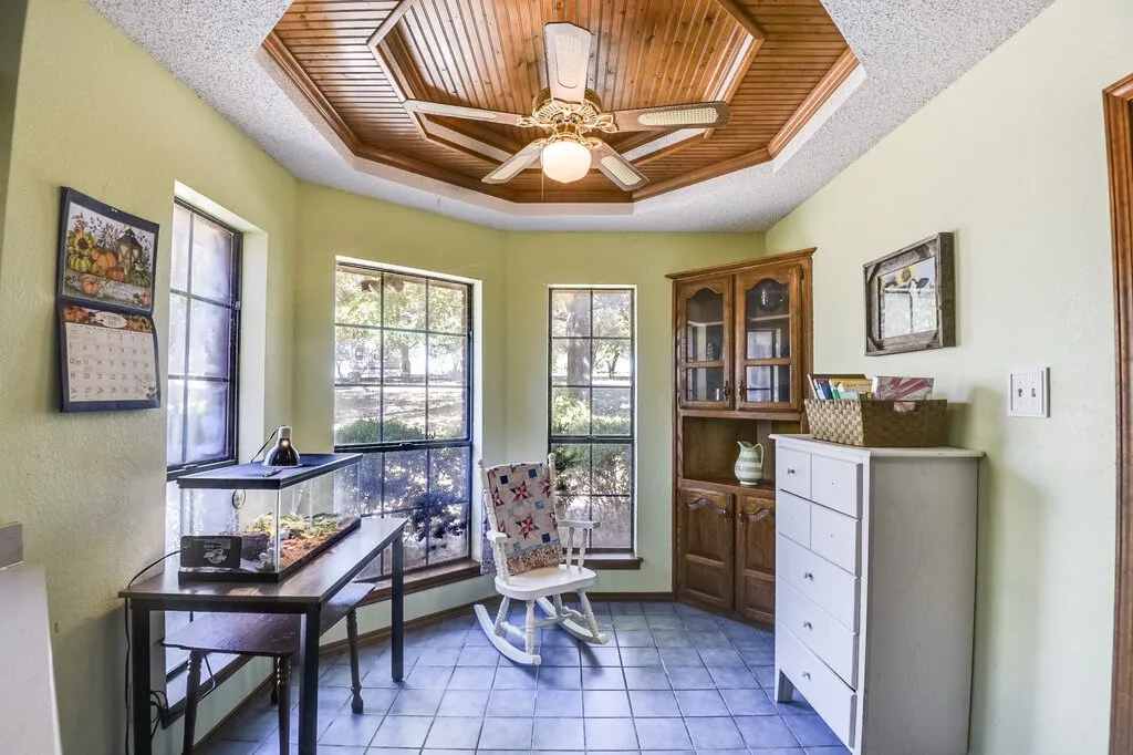 Kitchen Nook.  Take Note of the Beautiful Woodwork in the Ceiling and the Window View