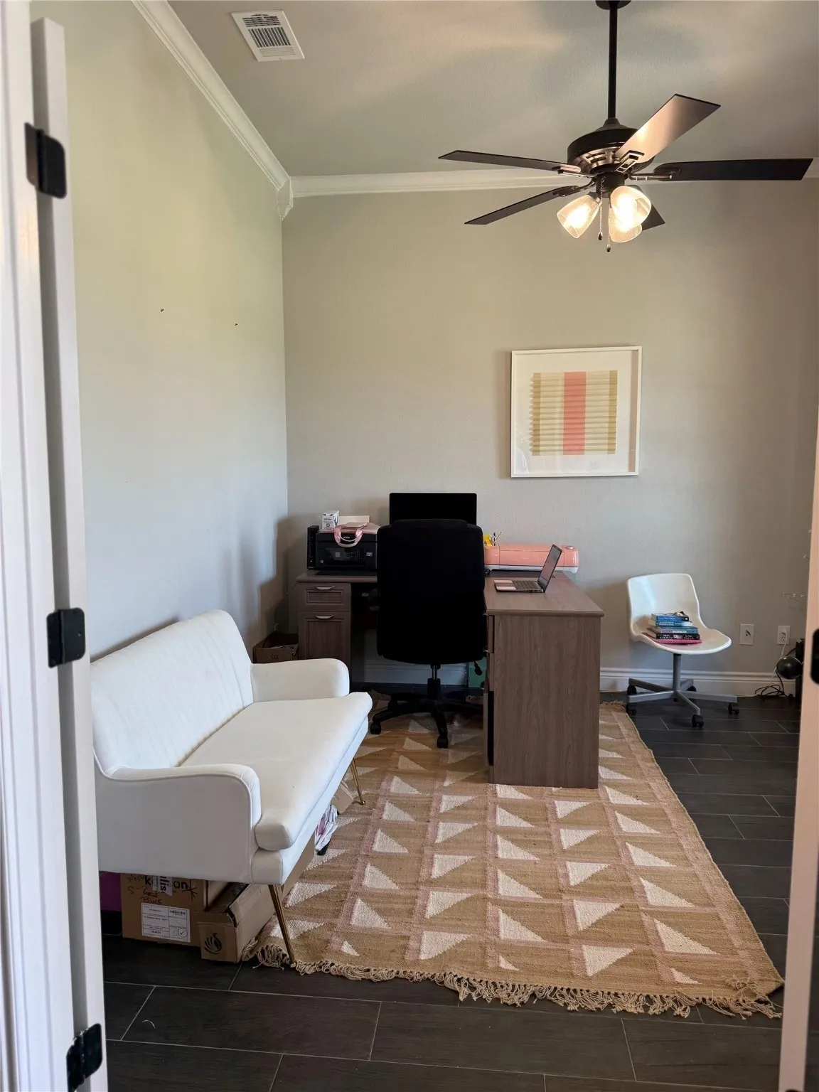 Crown molding and dark wood-finish flooring