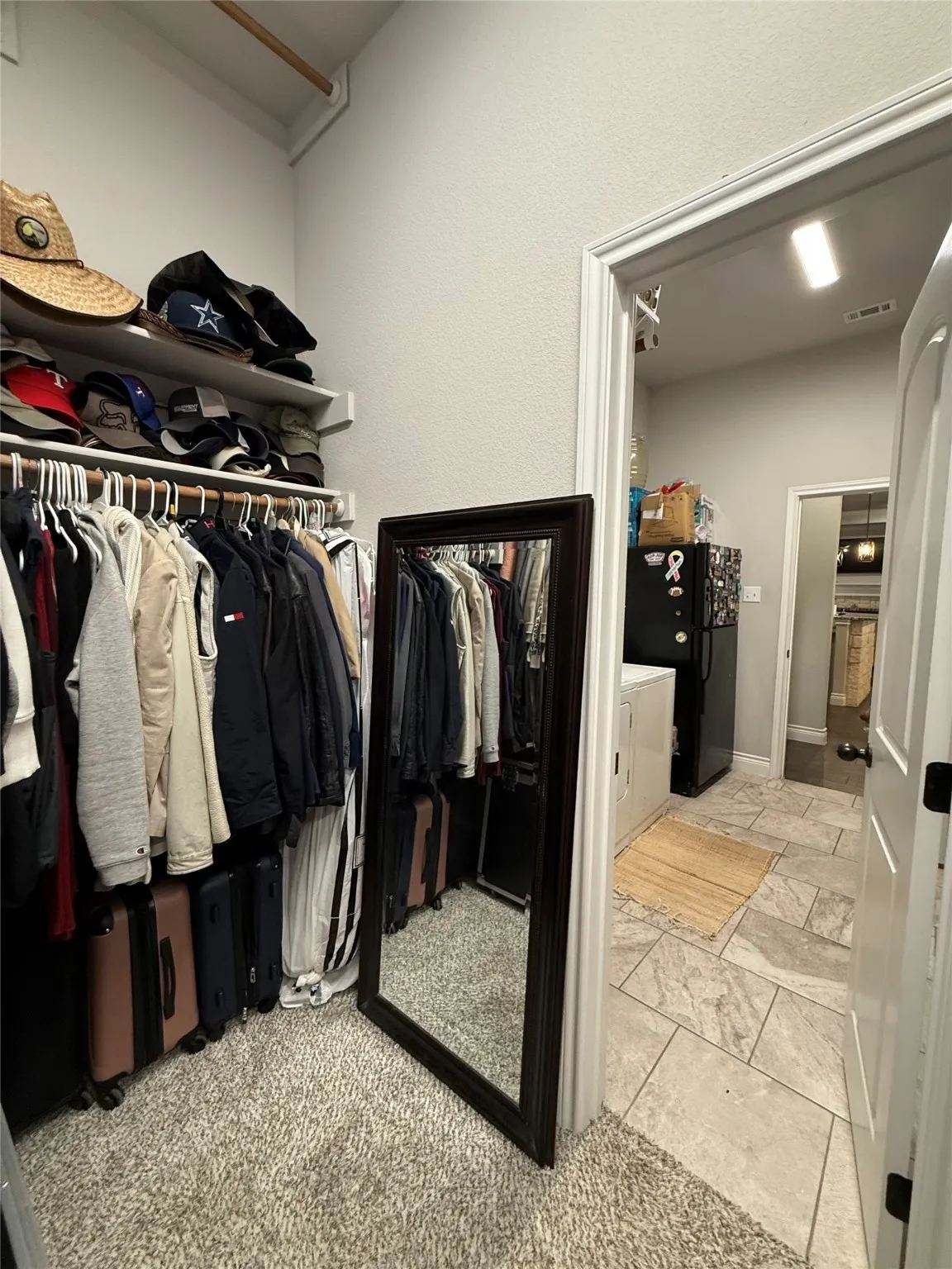 Carpeted floor with built-in shelving and clothes rods
