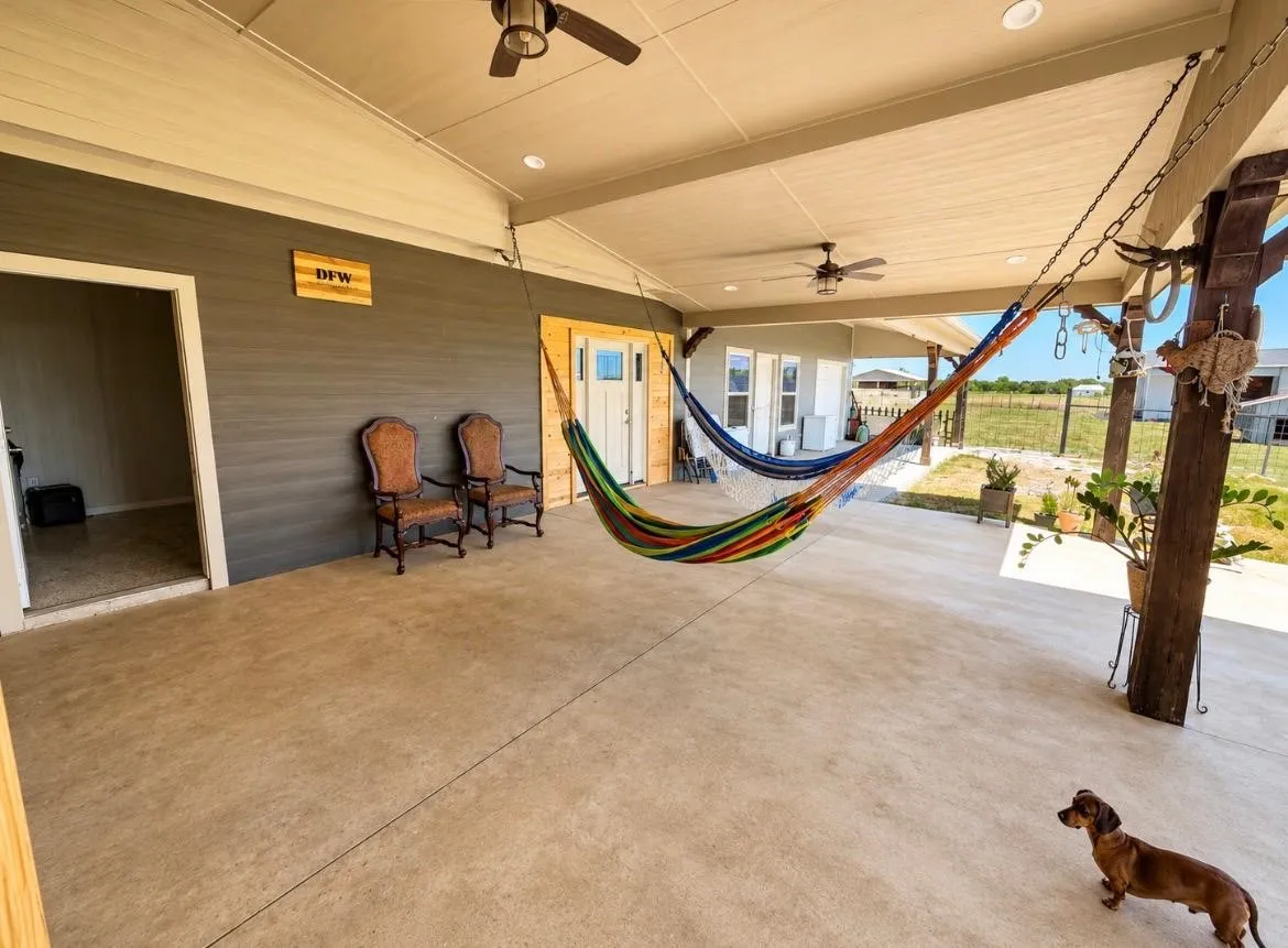 Covered patio featuring concrete flooring, ceiling fans, and recessed lighting