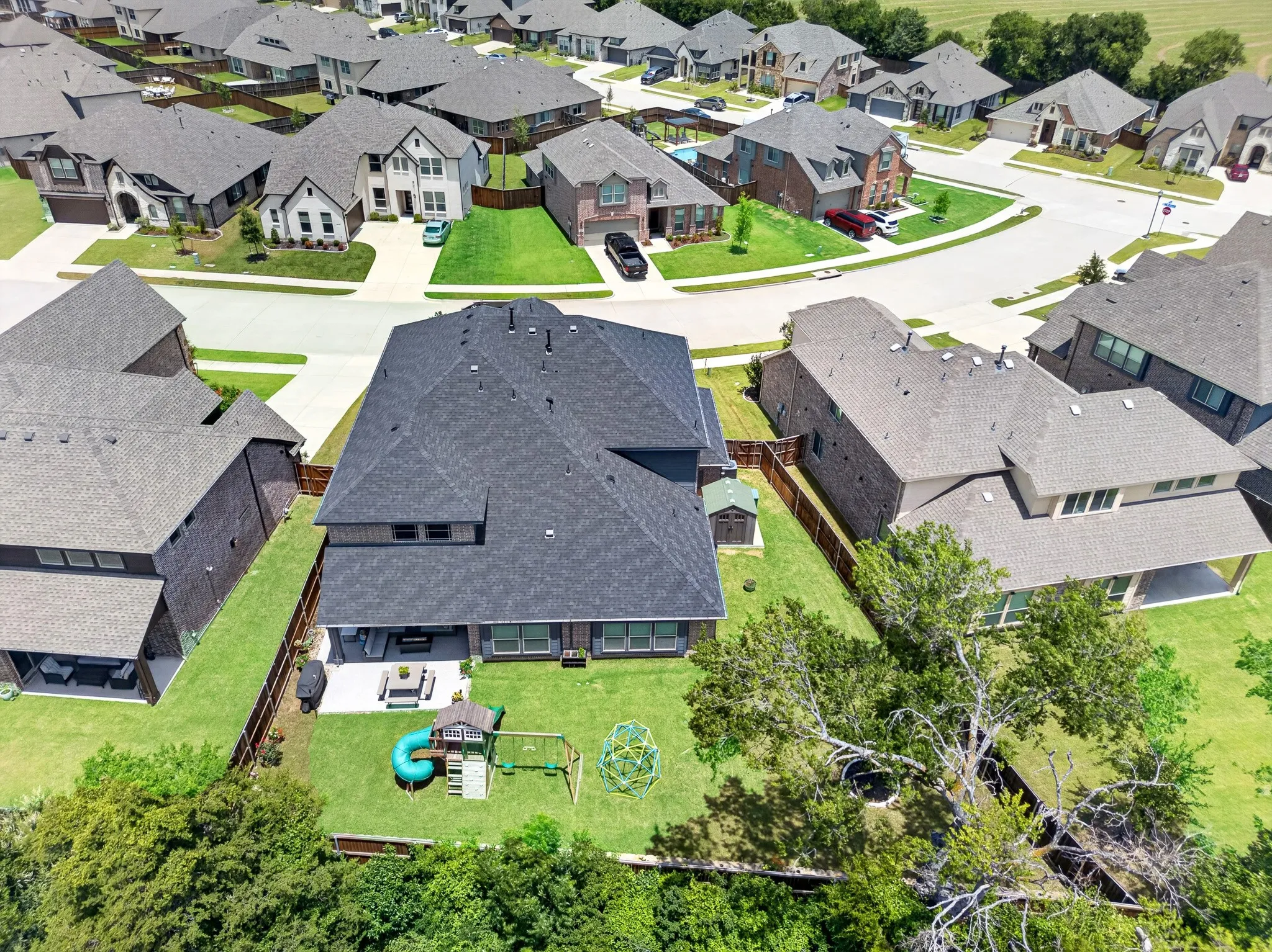 Great view of the large backyard and extended patio
