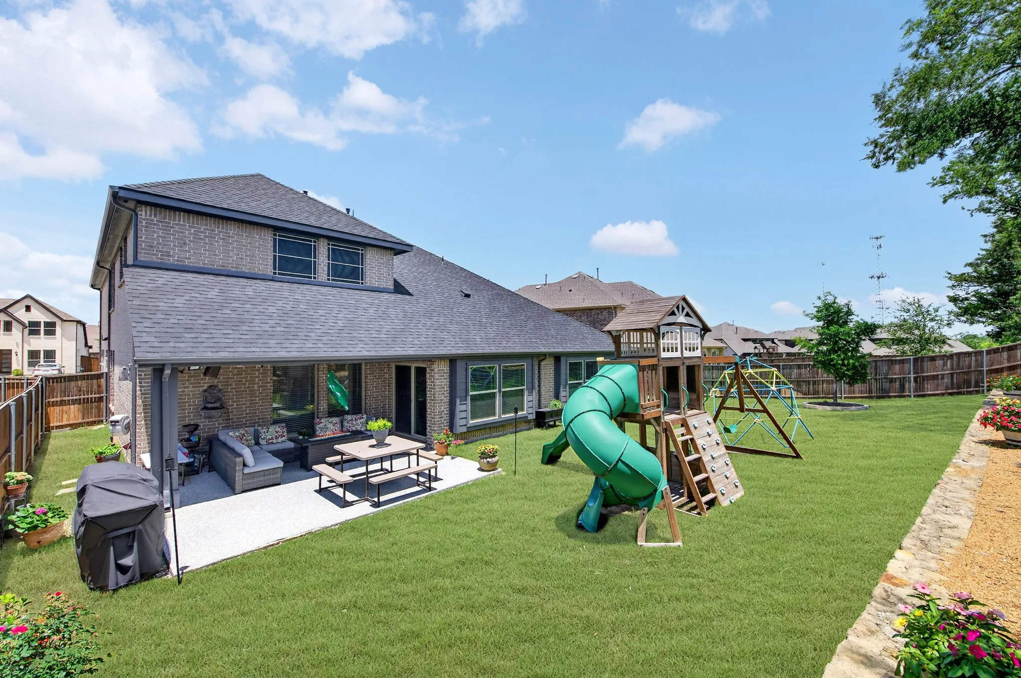 Large backyard with extended patio and great outdoor living area.