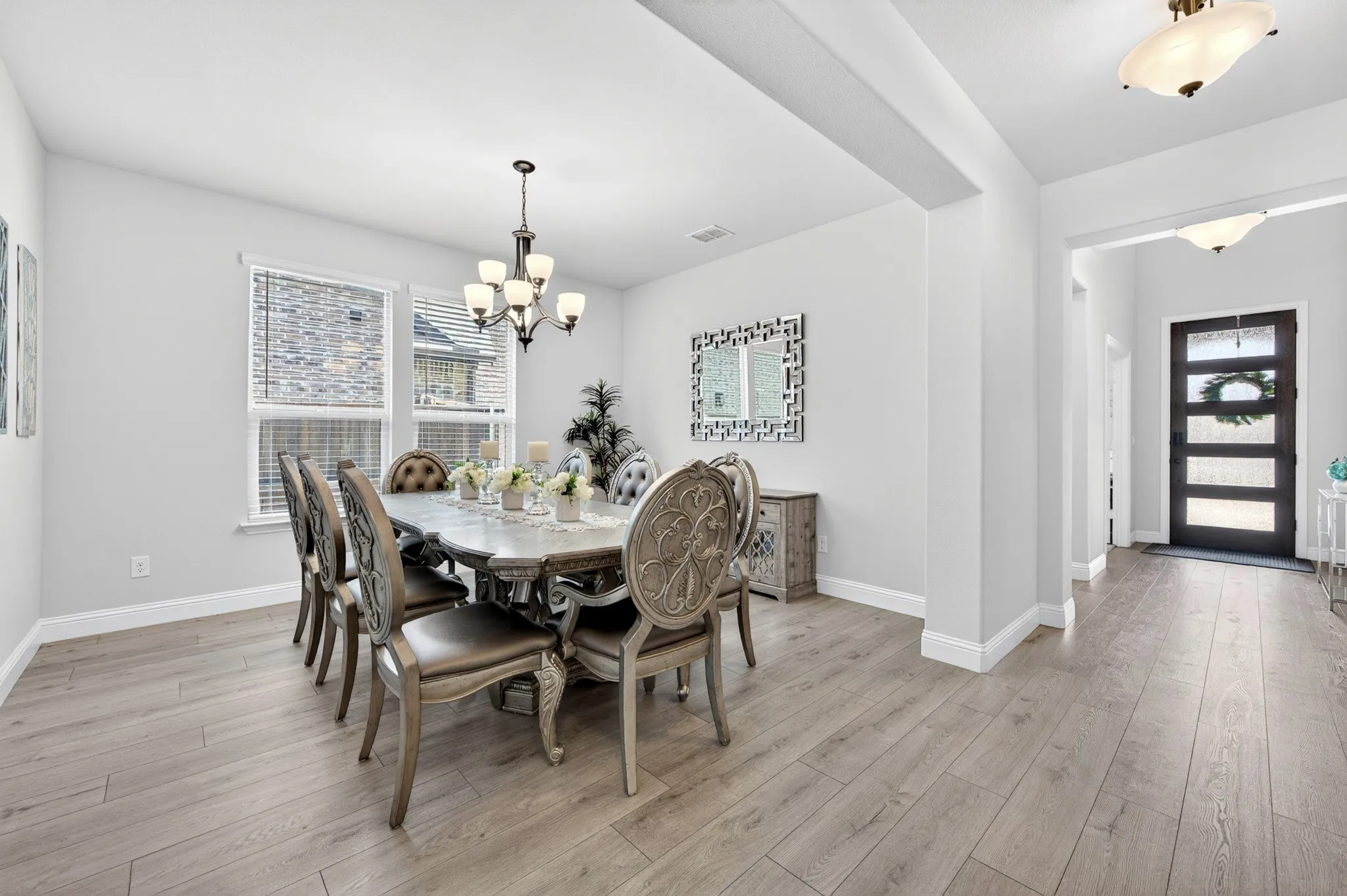 Large Dining Area off Main Grand Hallway with Chandeliers