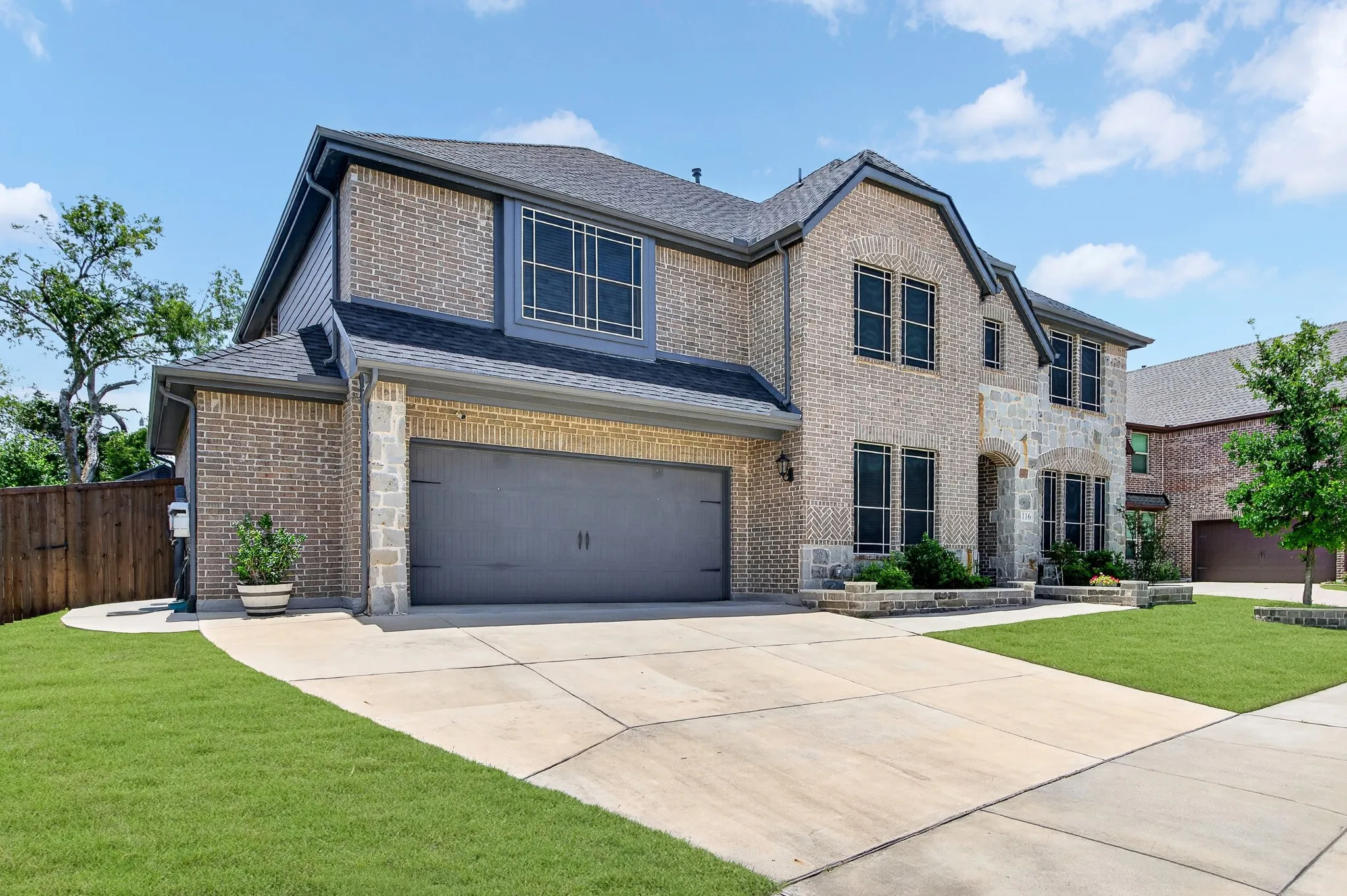 North Facing home with 2.5 Garage with extra wide driveway.