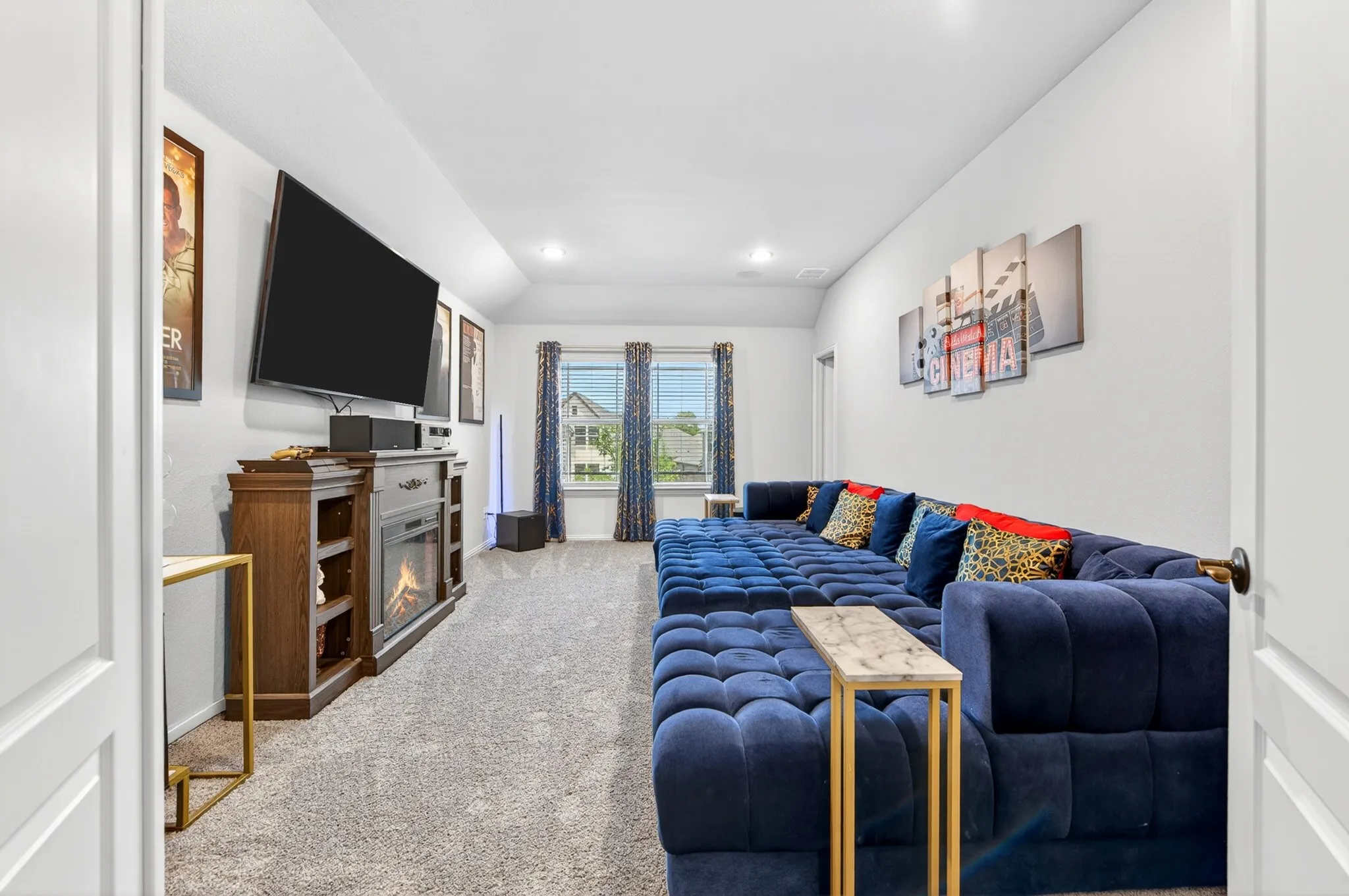 Media room with double doors and walk in closet could be used as a 6th Bedroom.