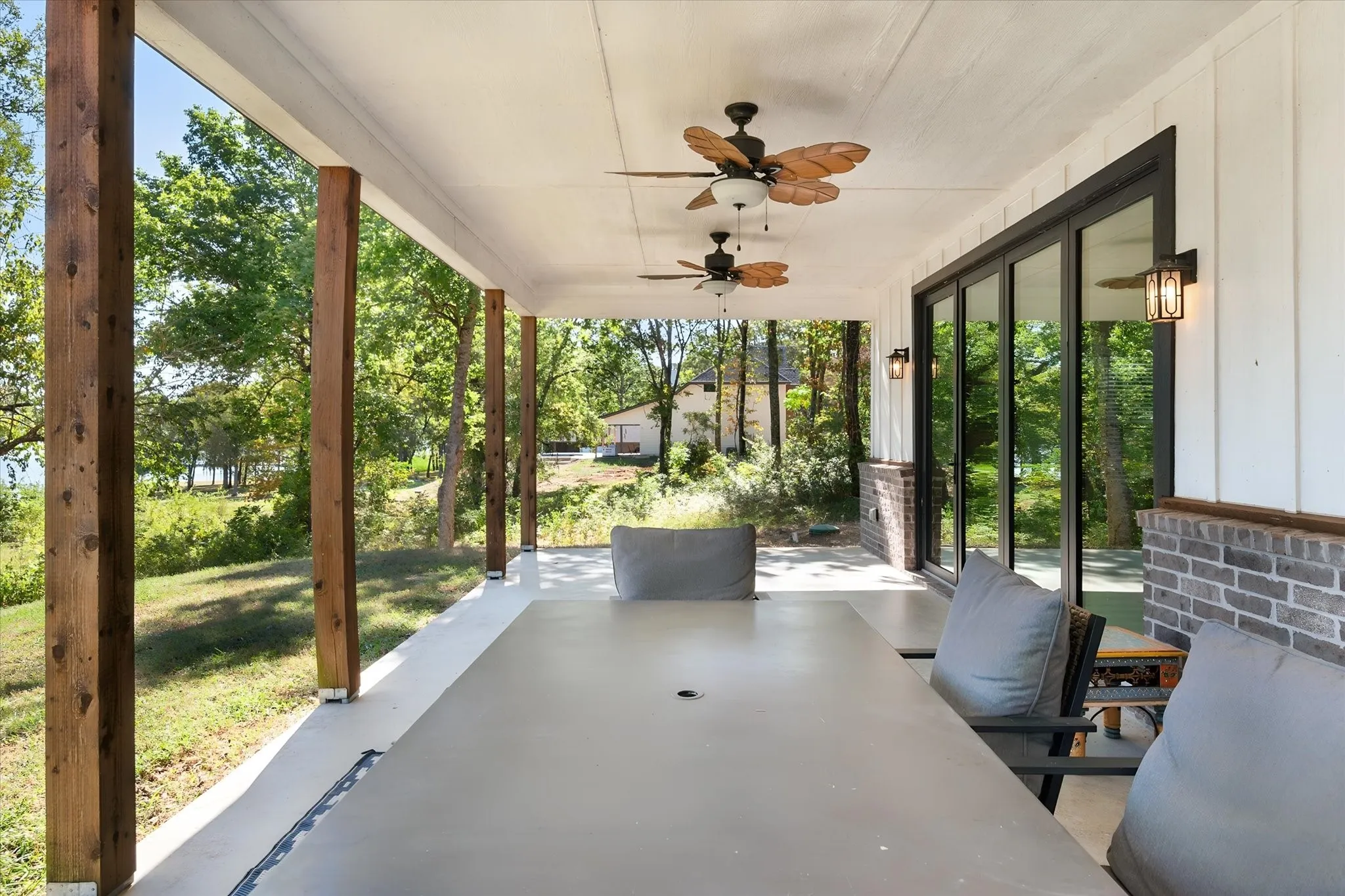 Expansive covered rear porch offers multiple ceiling fans and generous outdoor living space just steps from the Richland Chambers Lake shoreline.
