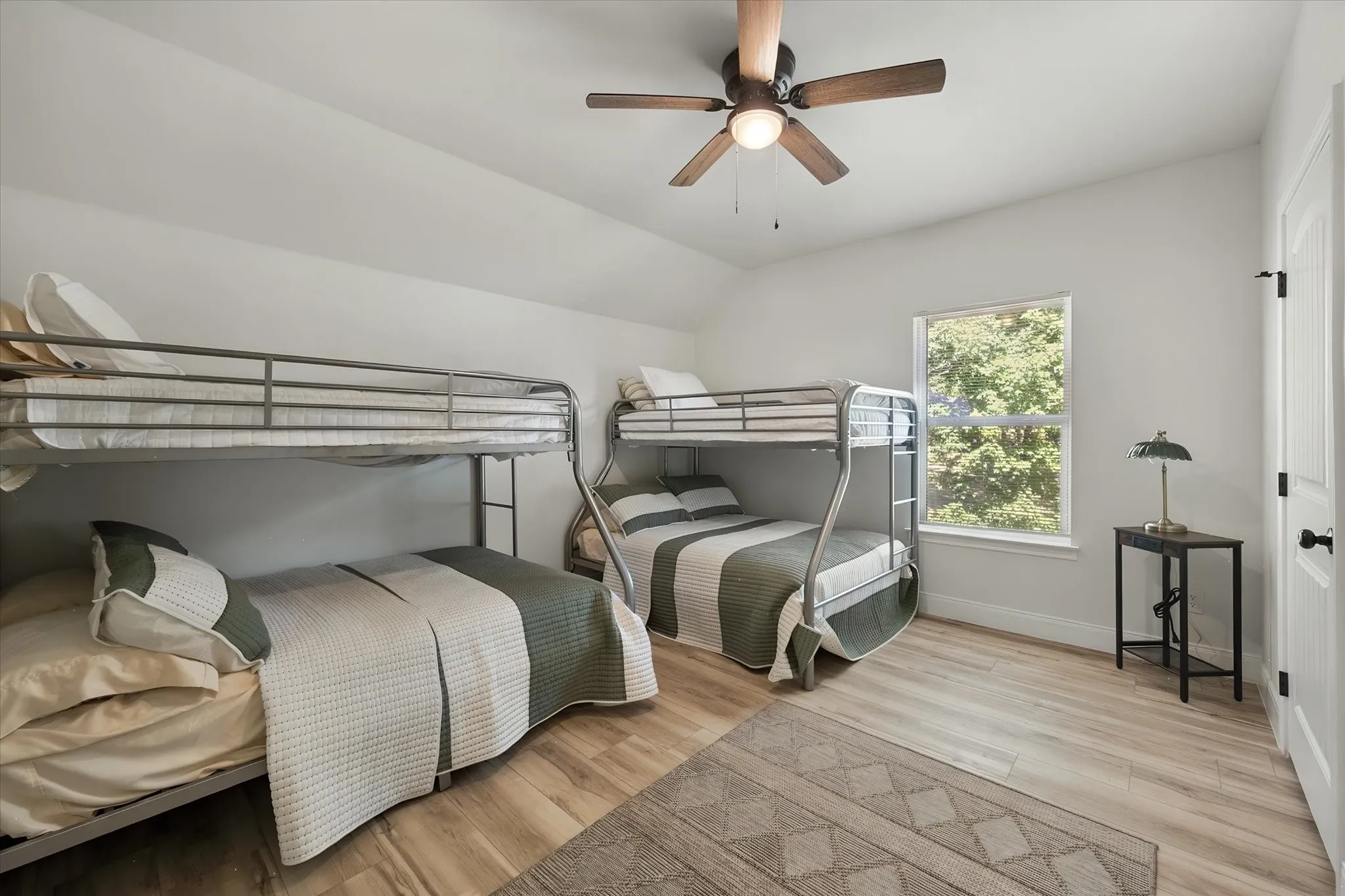 Spacious bunk room provides abundant sleeping accommodations, ideal for hosting family and friends during weekends at Richland Chambers Lake.