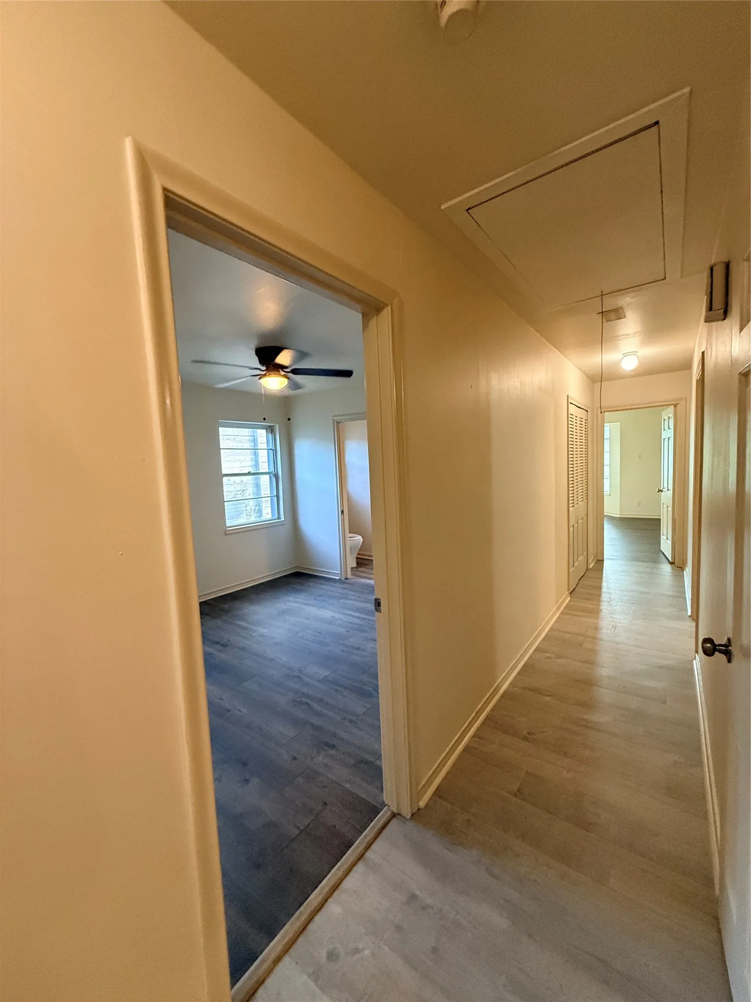 Hallway featuring wood-finish flooring, recessed lighting, and access panel