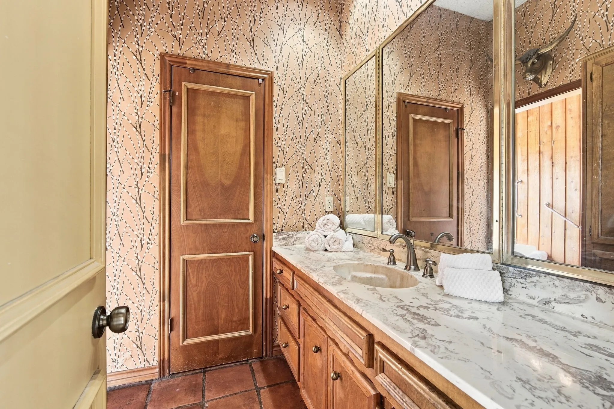 Primary vanities are separate dressing areas with walk in closets, sharing the wet area.