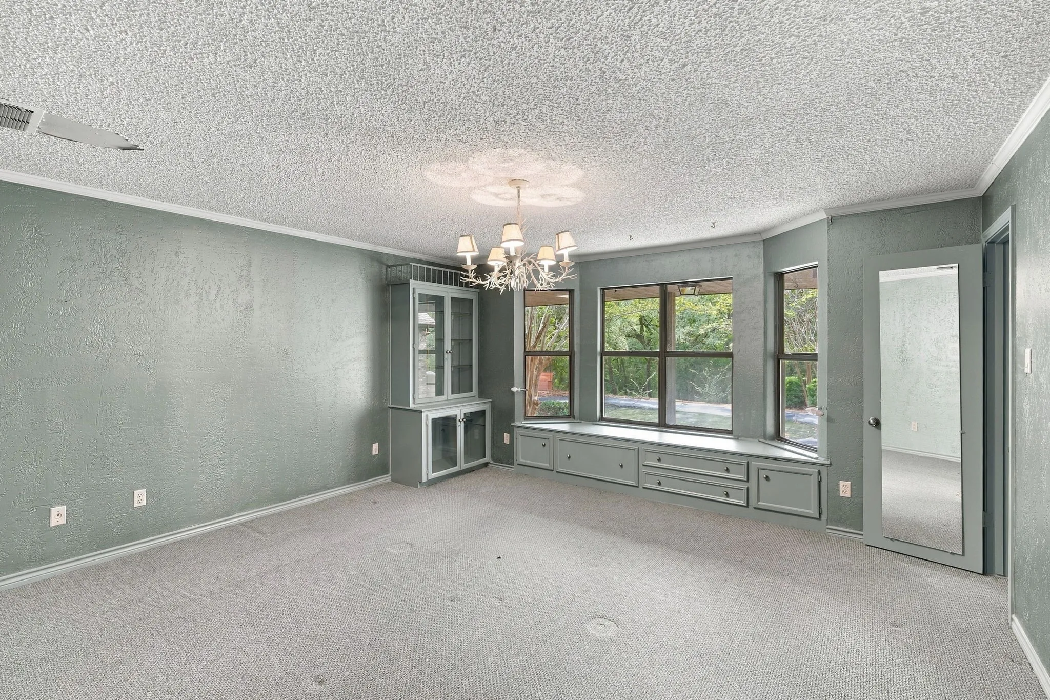 Secondary bedroom with huge walk in closet and connecting bath, built ins and window seat.