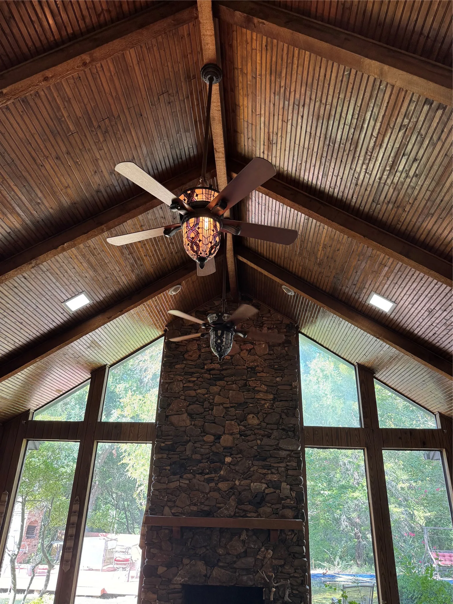 Beautiful vaulted tongue and groove ceiling with solid wood beams are the focal point in this great room just inside the entryway