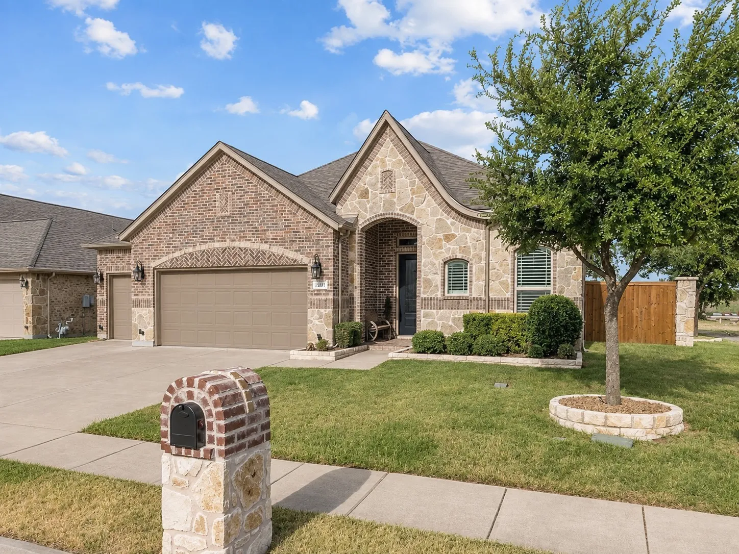 Brick and stone exterior with an arched entryway