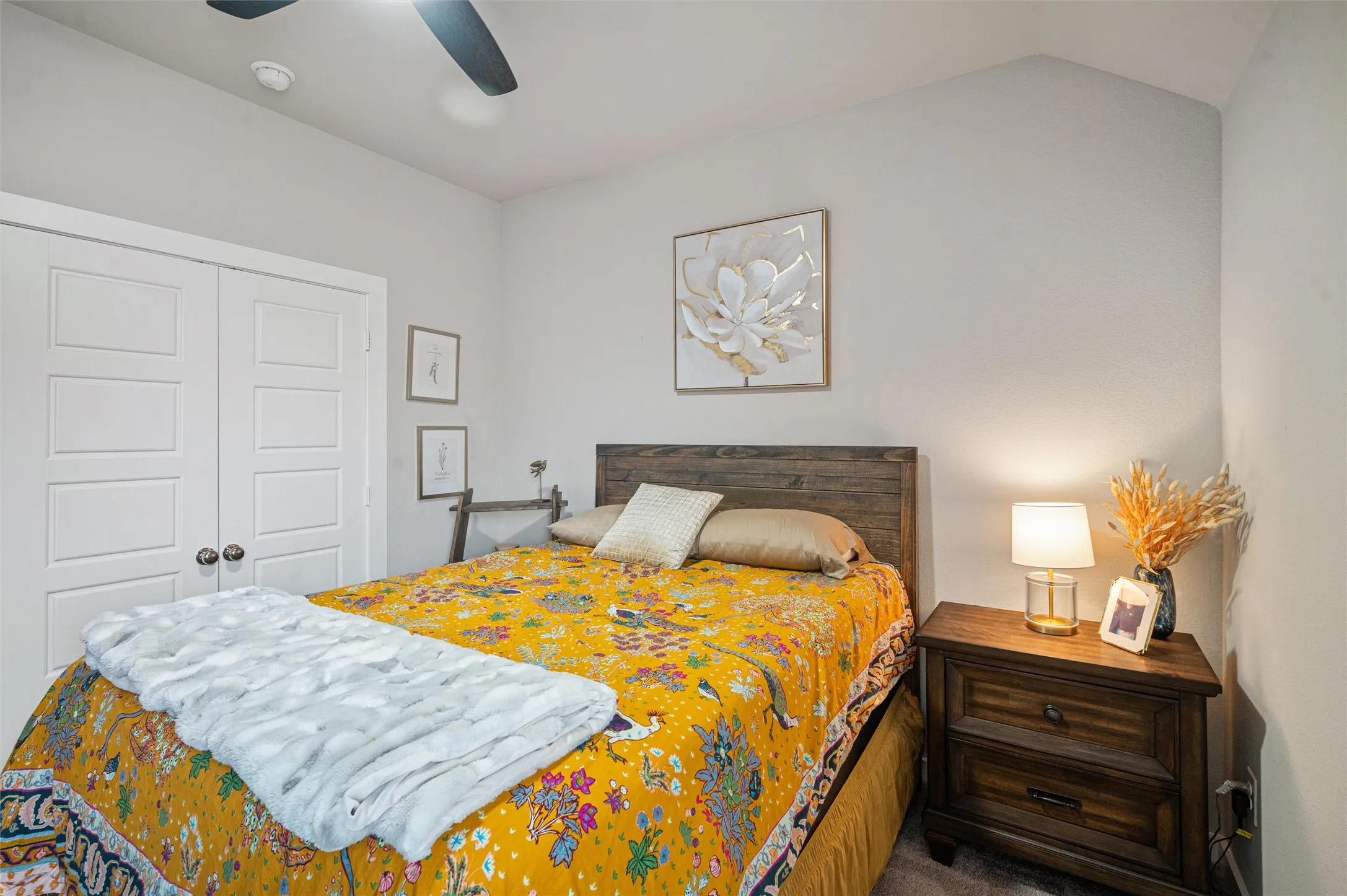 Vaulted ceiling with a ceiling fan, recessed lighting, and a wood-finish headboard