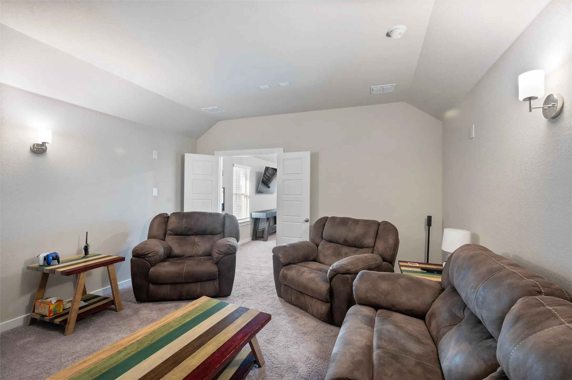 Neutral-toned walls with vaulted ceiling