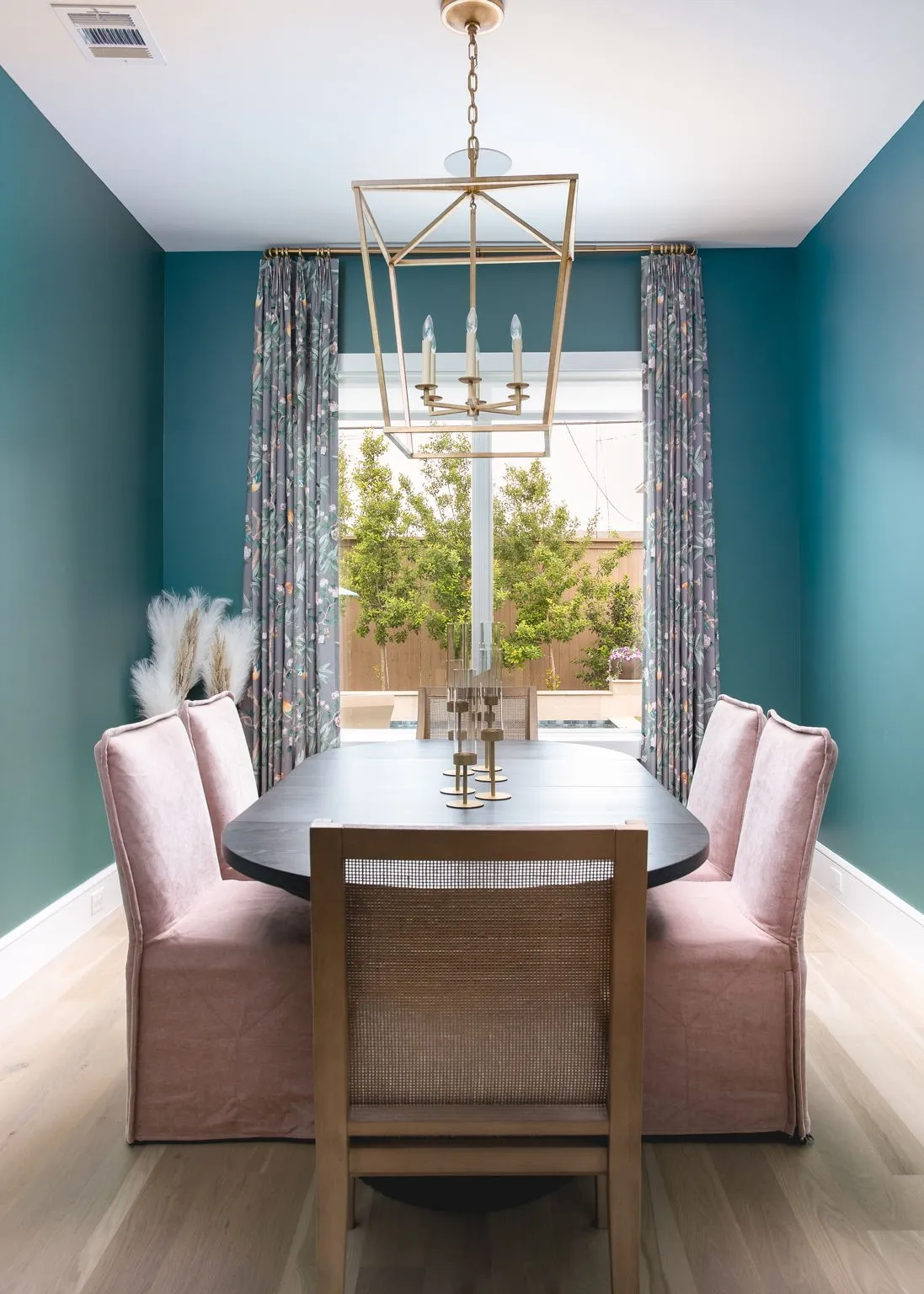 Recessed lighting, wood-finish flooring, and a contemporary chandelier