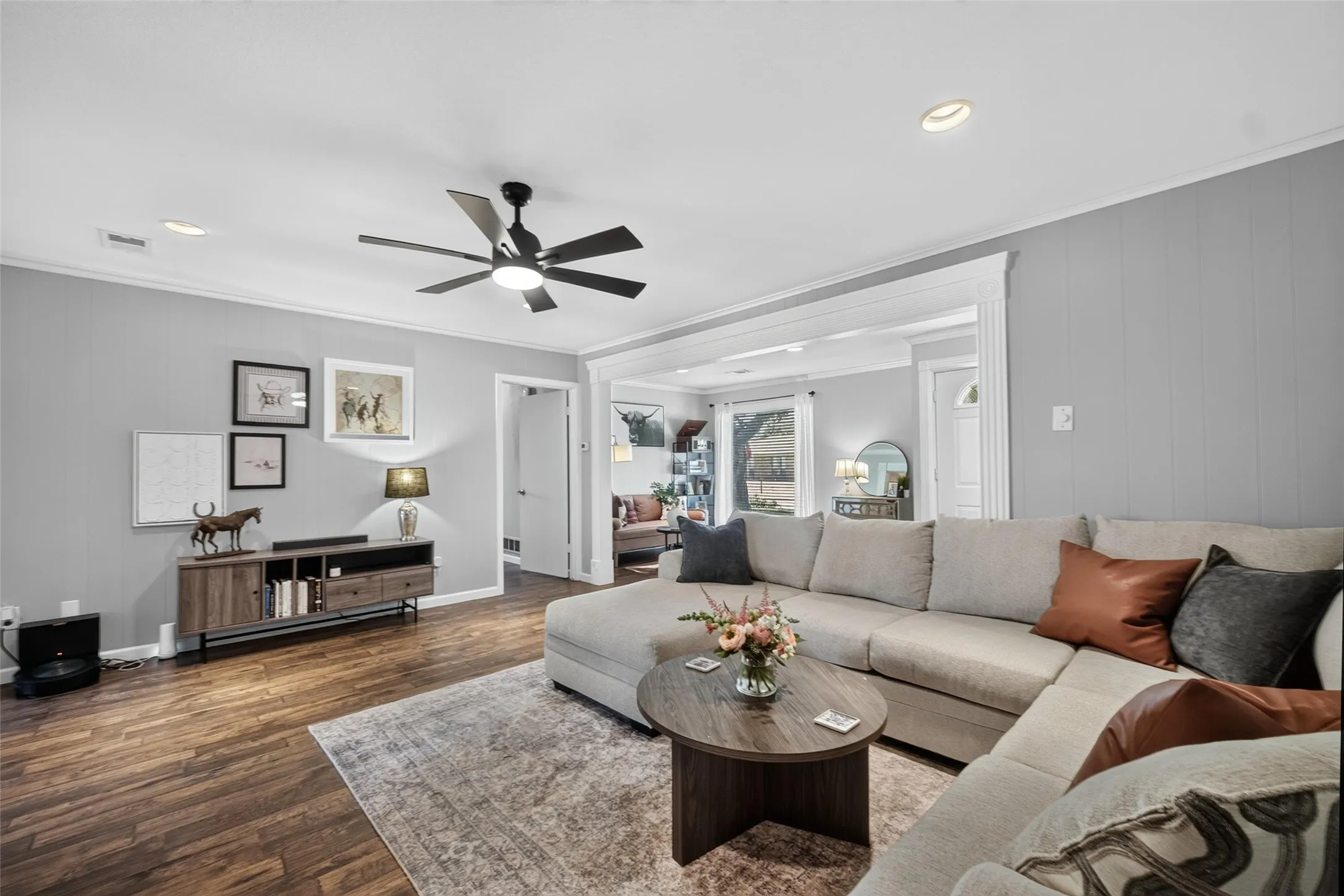 Wood-finish flooring, recessed lighting, and a modern ceiling fan