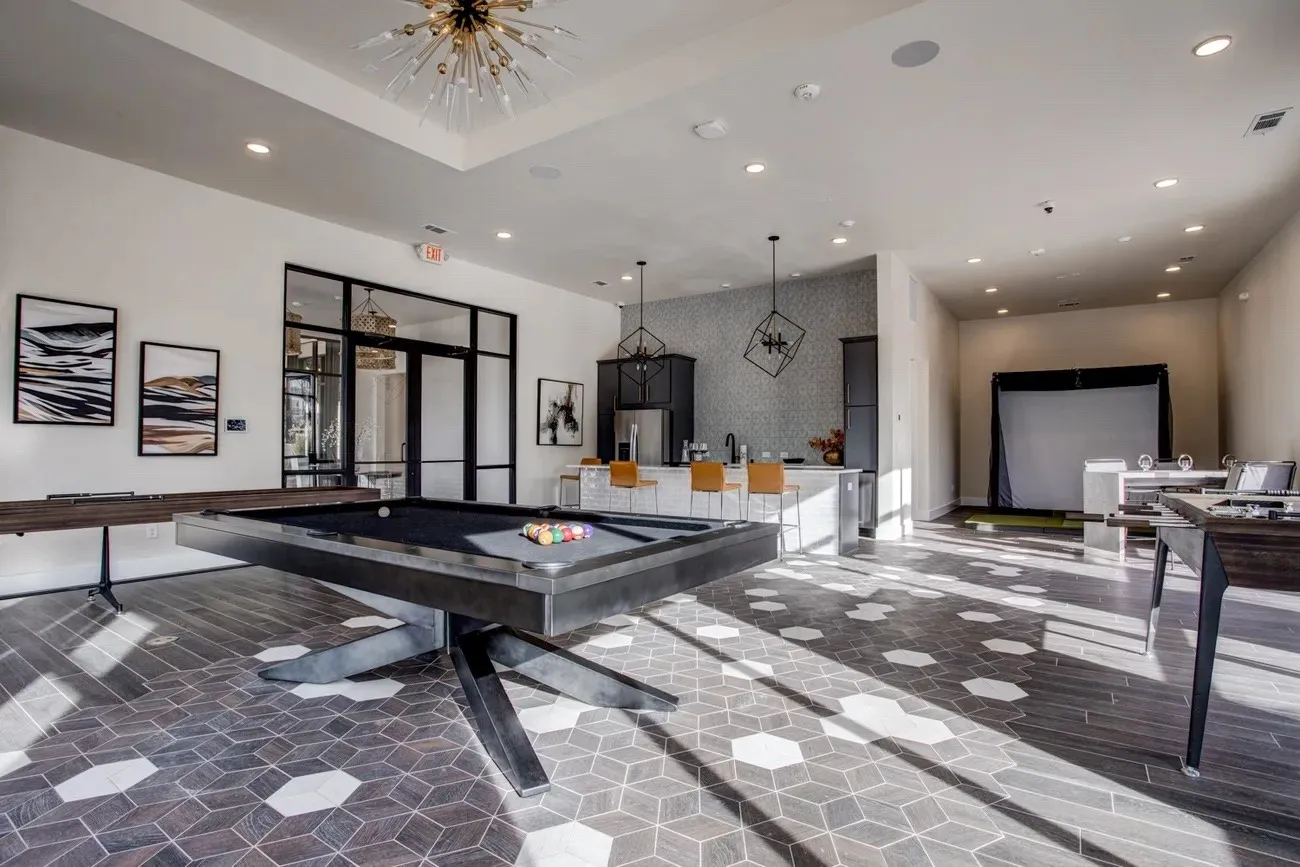 Alternate game room with golf simulator.