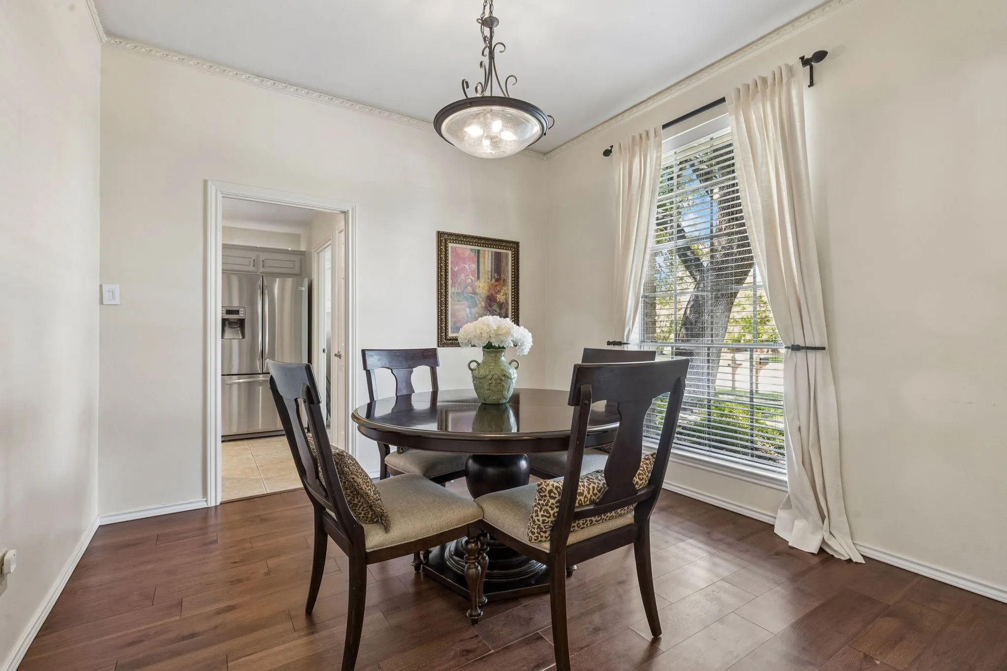 Dining Room with large window and wood floors