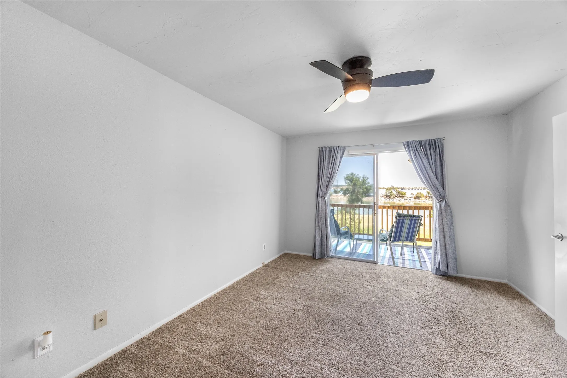 Primary bedroom with access to balcony