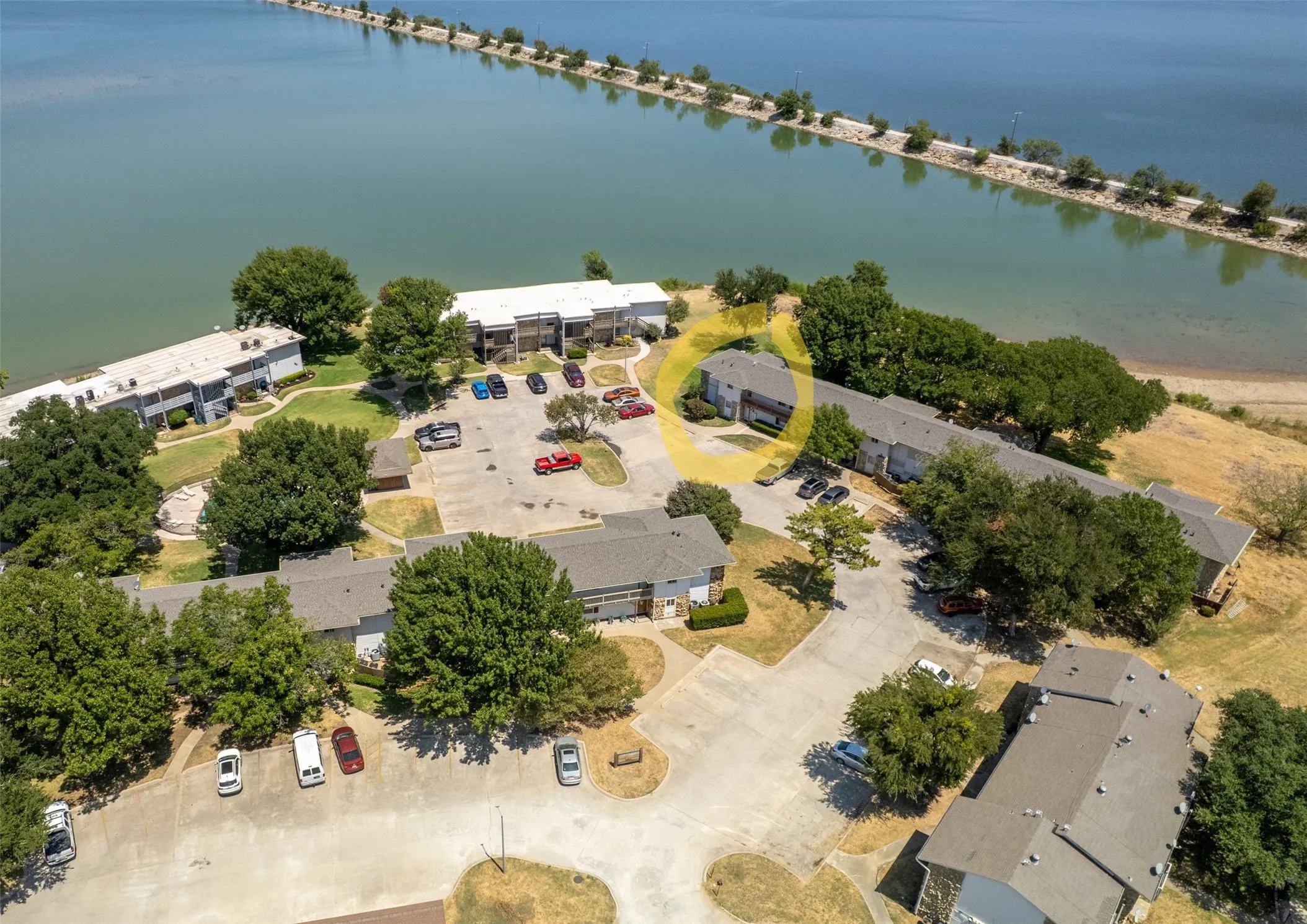 Aerial view of area. Condo is circled in yellow.