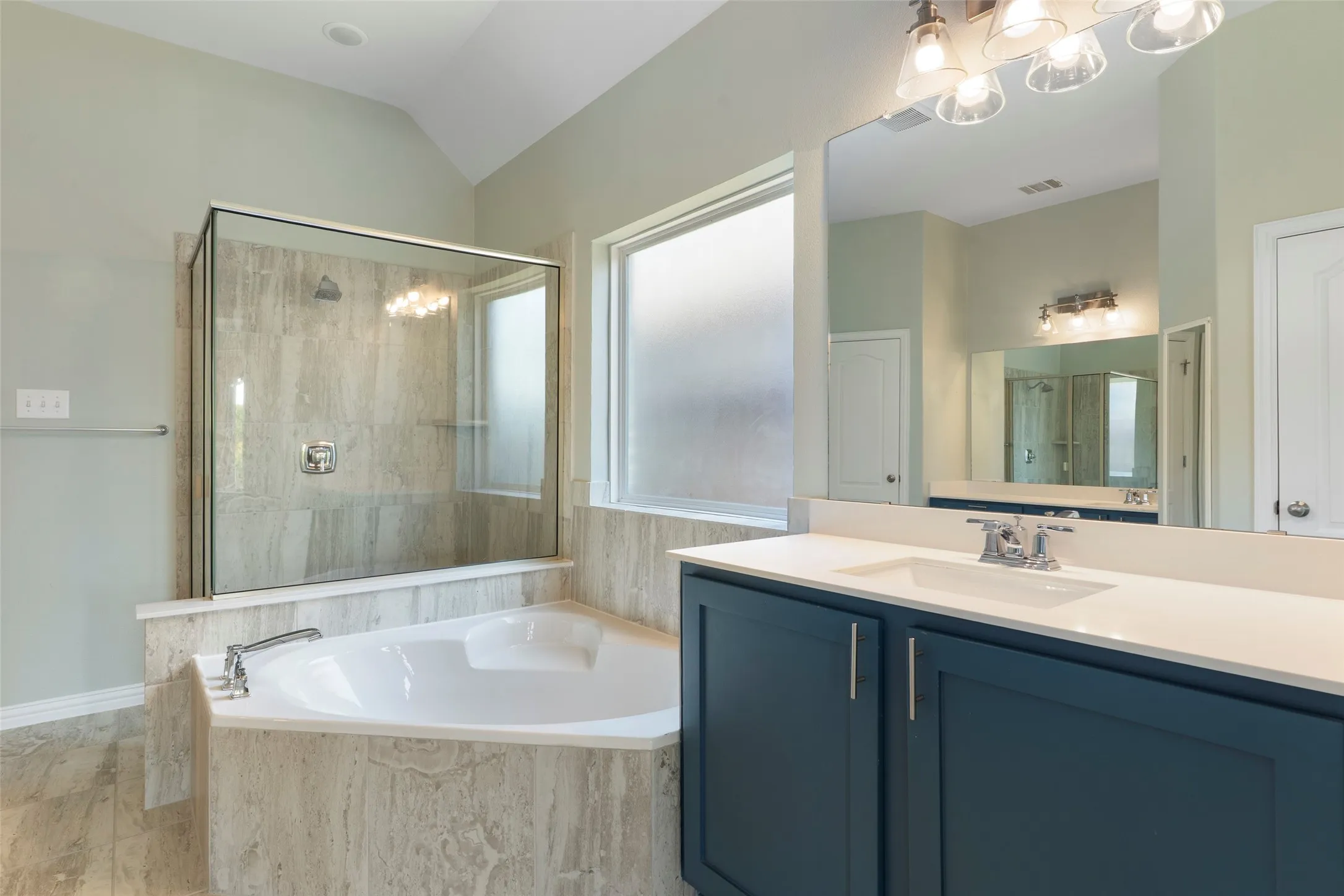 Separate tub and shower, along with separate vanities