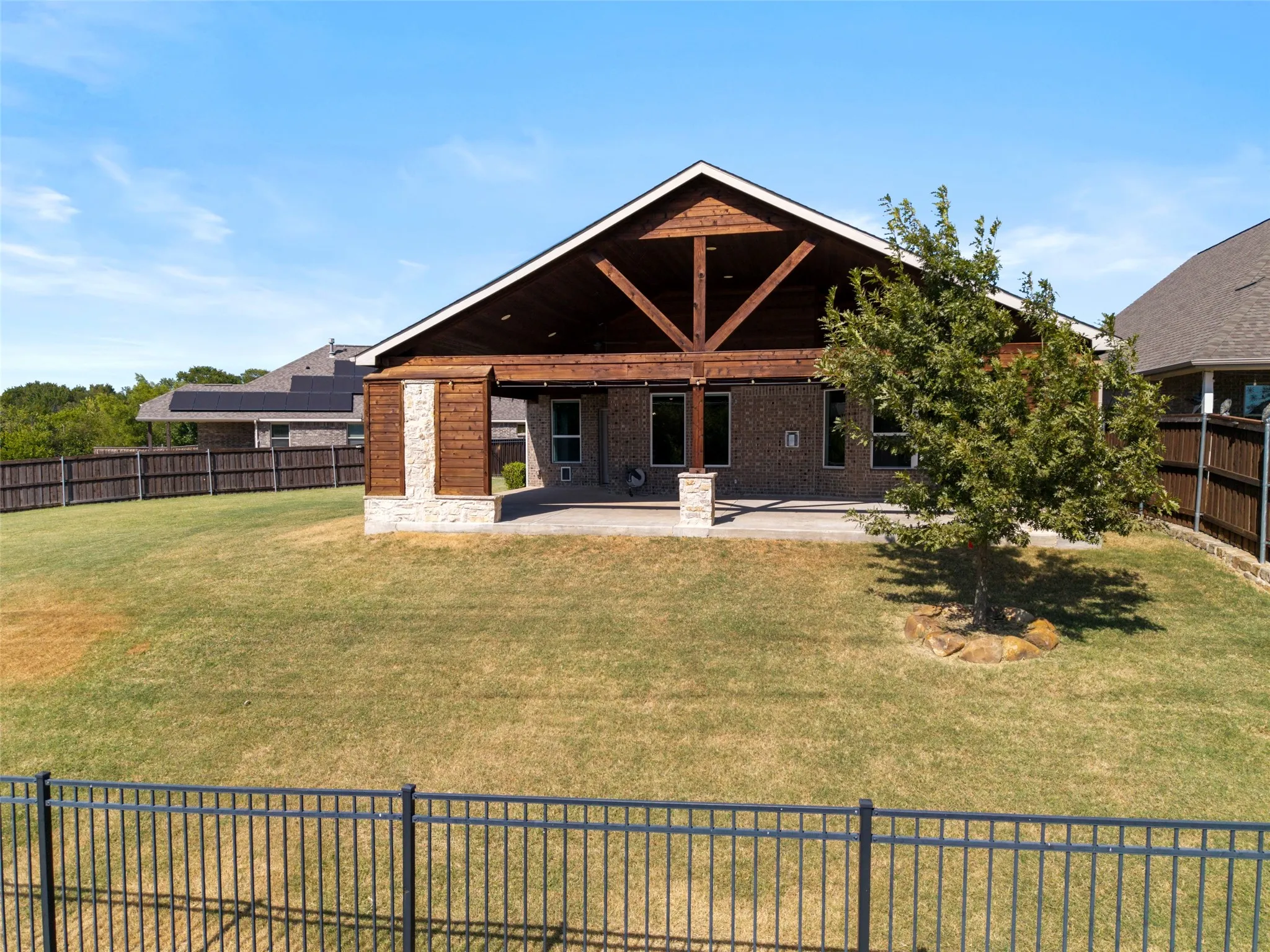 Check out this HUGE Covered Patio on this HUGE yard with views!!