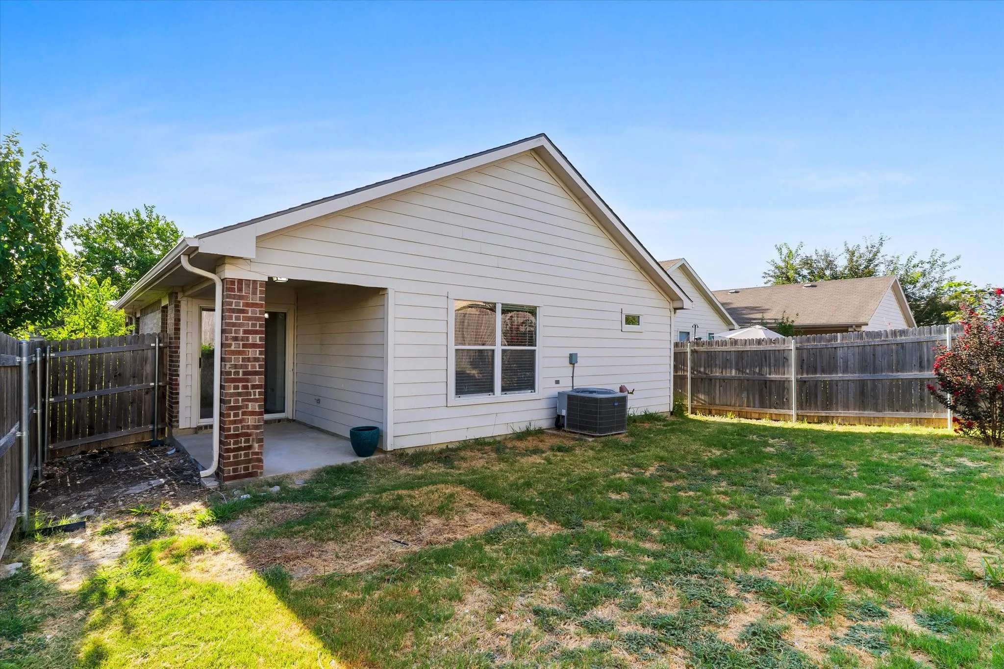Covered patio and fenced back yard