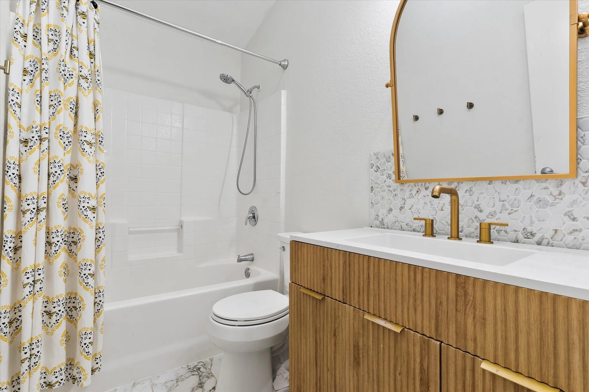 Remodeled with updated tub/shower and vanity.