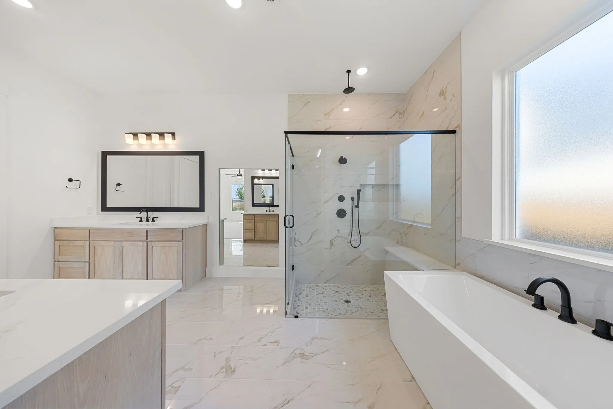 With ample room for two, an oversized walk in shower and freestanding tub, this owner's bath is a dream come true!
