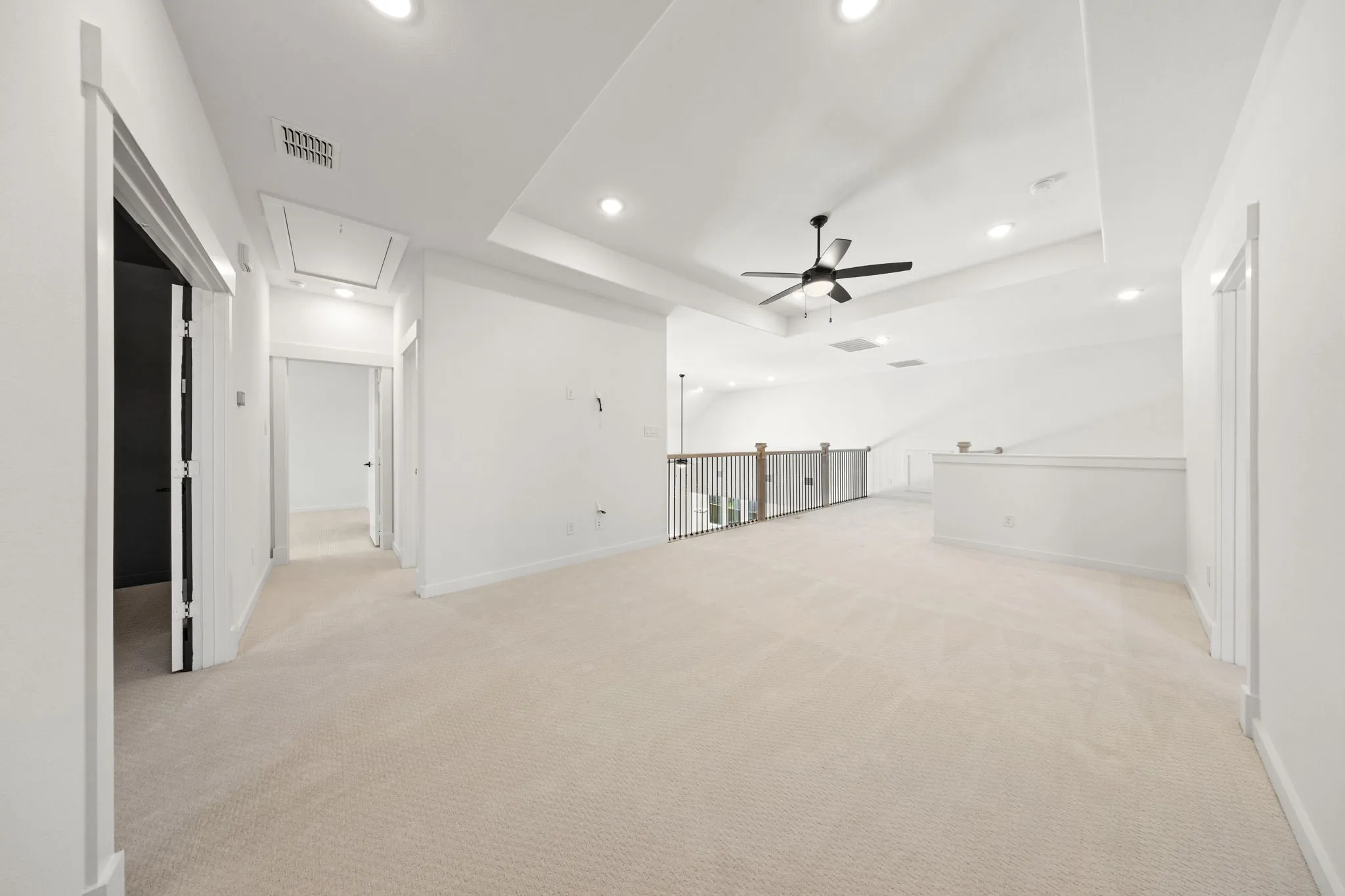 Light and bright, the family will love getting together for game night in this wonderful game room!
