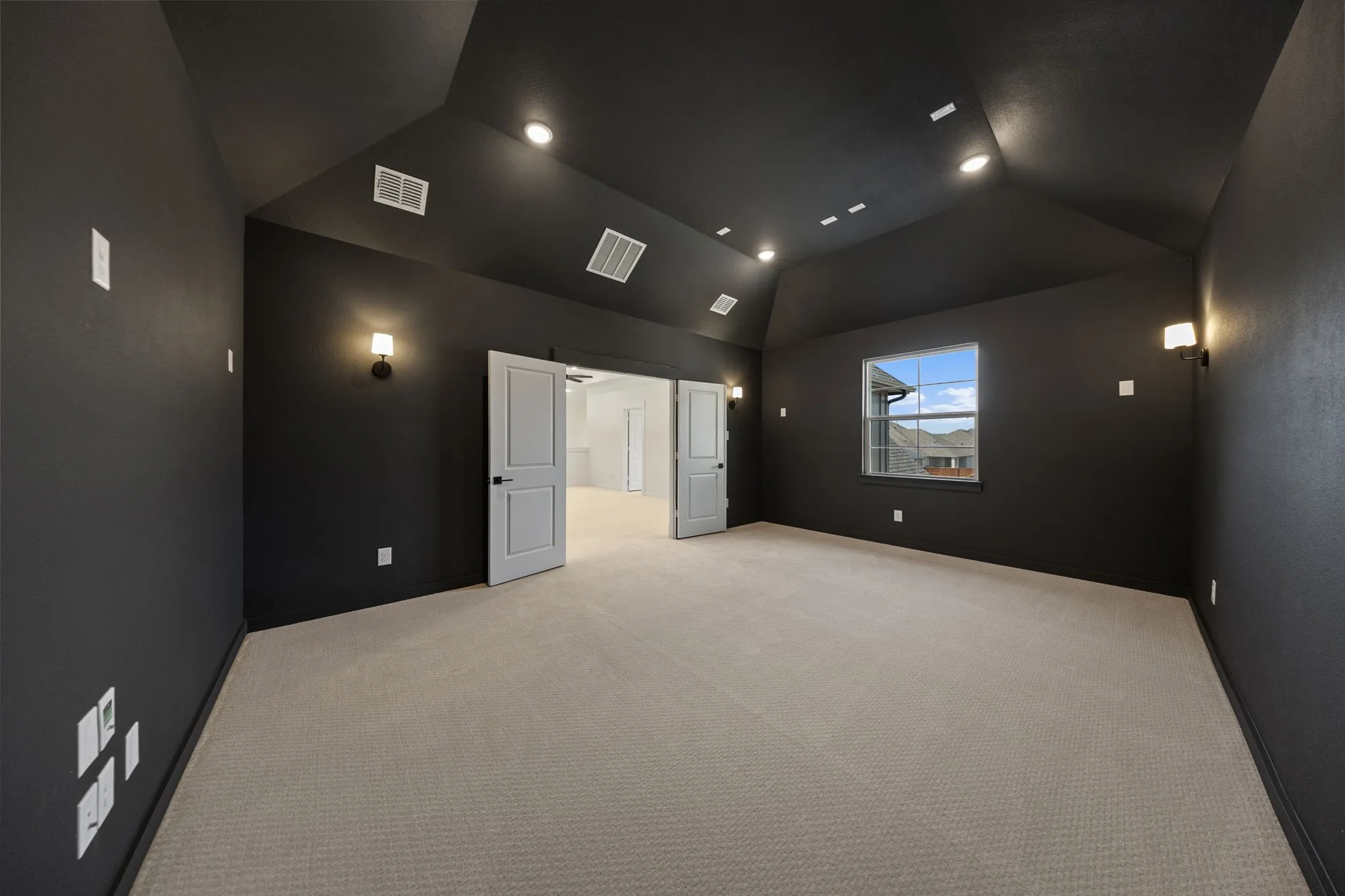This spacious media room paired with adjacent game room create the ultimate family entertainment zone!