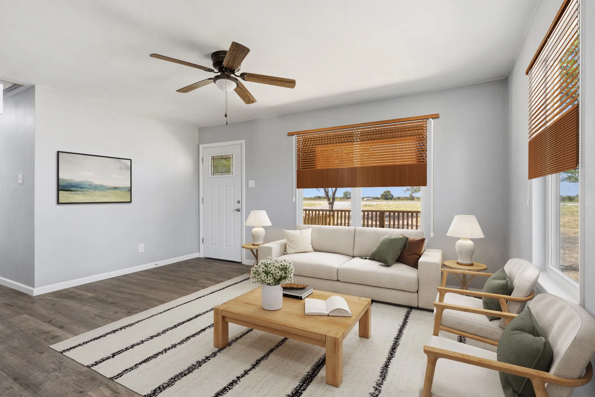 Wood-finish flooring throughout, light gray wall paint, and a ceiling fan with wood-finish blades, virtually staged