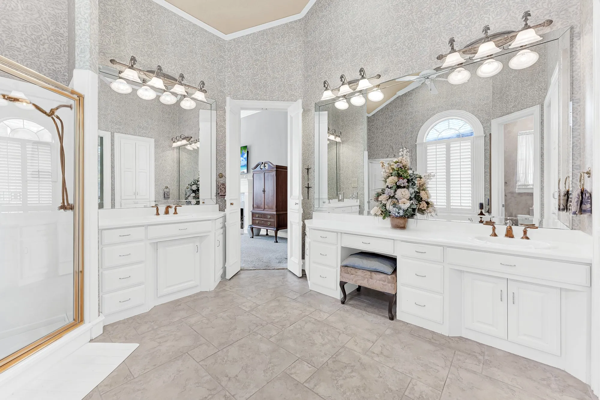 Expansive wall mirrors multiply the ambient light while reflecting neat built-in storage solutions. Enjoy plenty of elbow room while trying out your favorite weekend outfits.