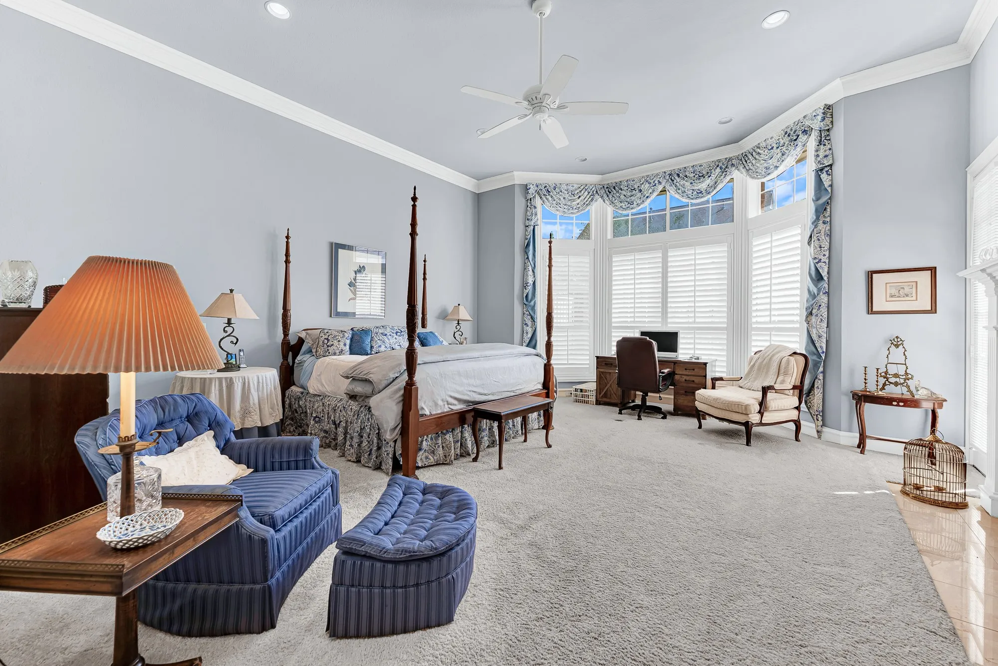 A sun-drenched alcove window creates an airy retreat for quiet reflection within the main bedroom suite. Sip your morning coffee here while looking out over the quiet neighborhood.