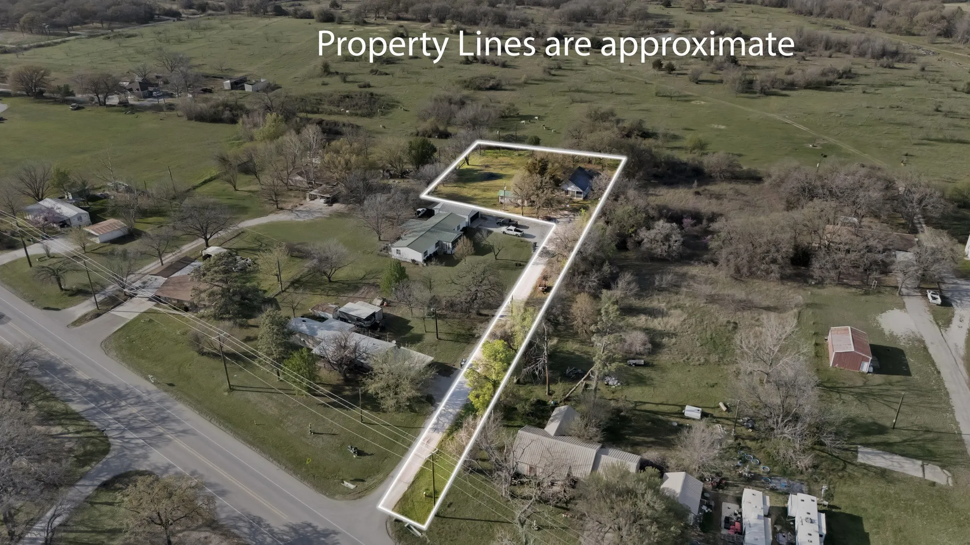 Aerial view of property and surrounding area with rural landscape and property boundaries highlighted